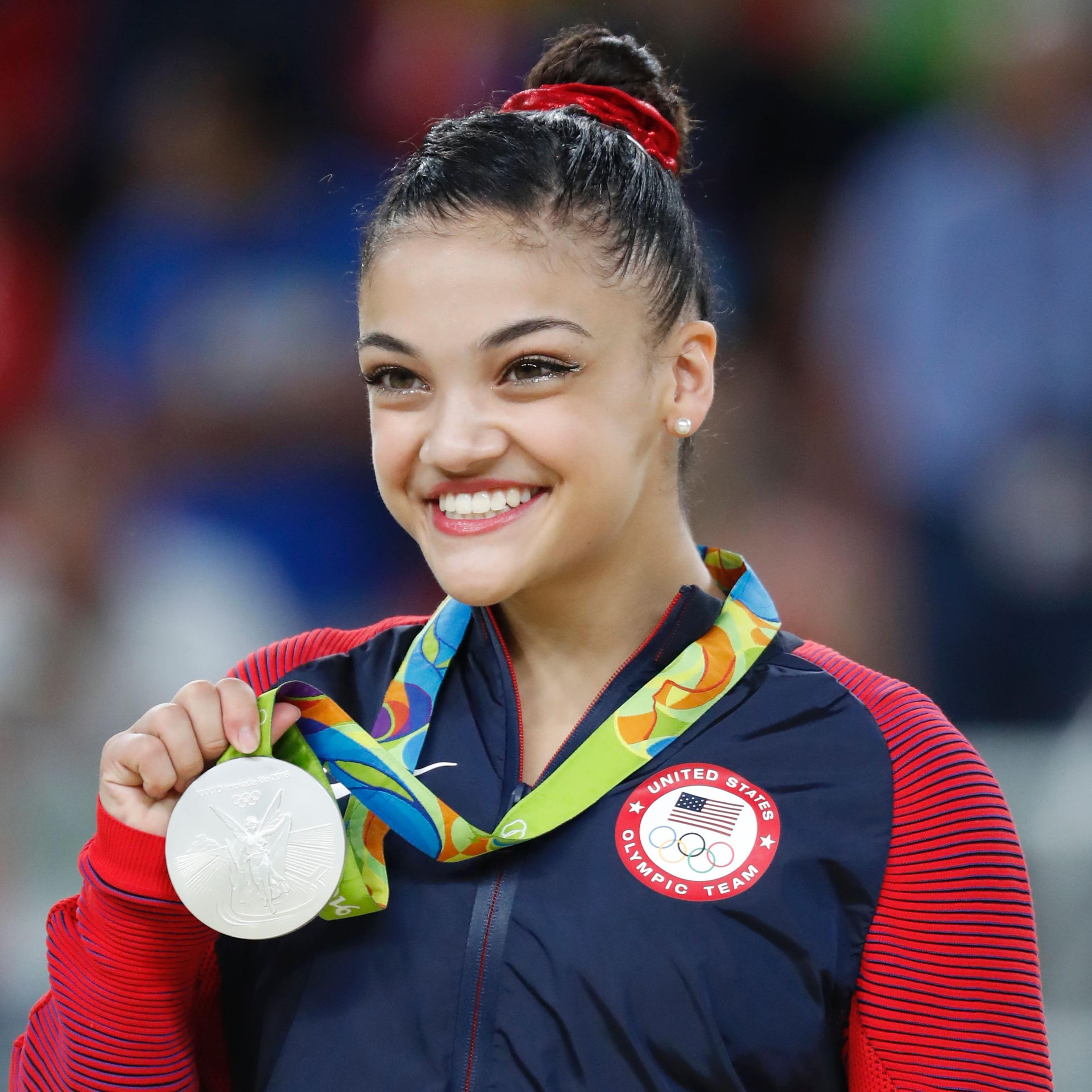 Silver medallist US gymnast Lauren Hernandez celebrates on the podium of the women's balance beam event final of the Artistic Gymnastics at the Olympic Arena during the Rio 2016 Olympic Games in Rio de Janeiro on August 15, 2016.