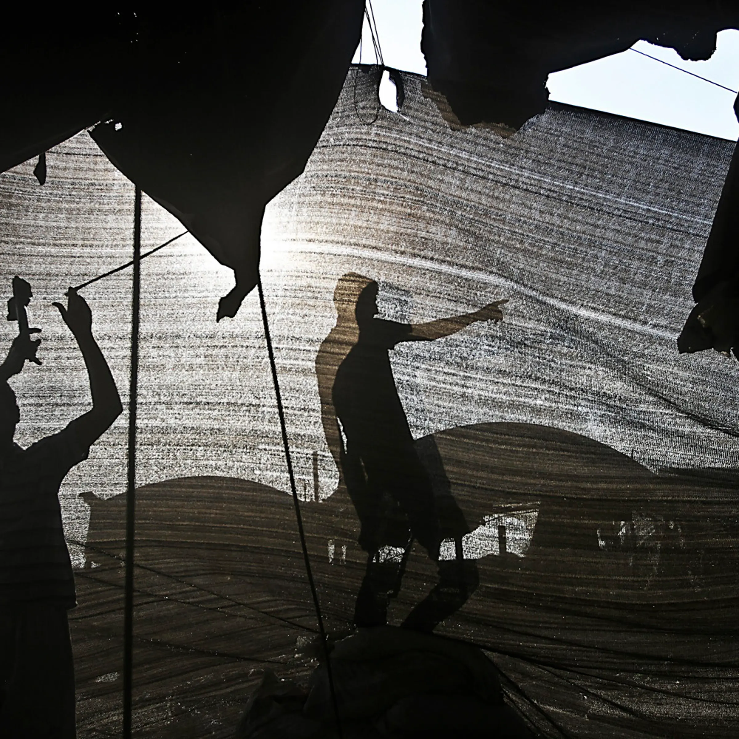 Dec. 2, 2012. Palestinian men repair a bombed smuggling tunnel connecting the Gaza Strip and Egypt, in Rafah, in the southern Gaza Strip.