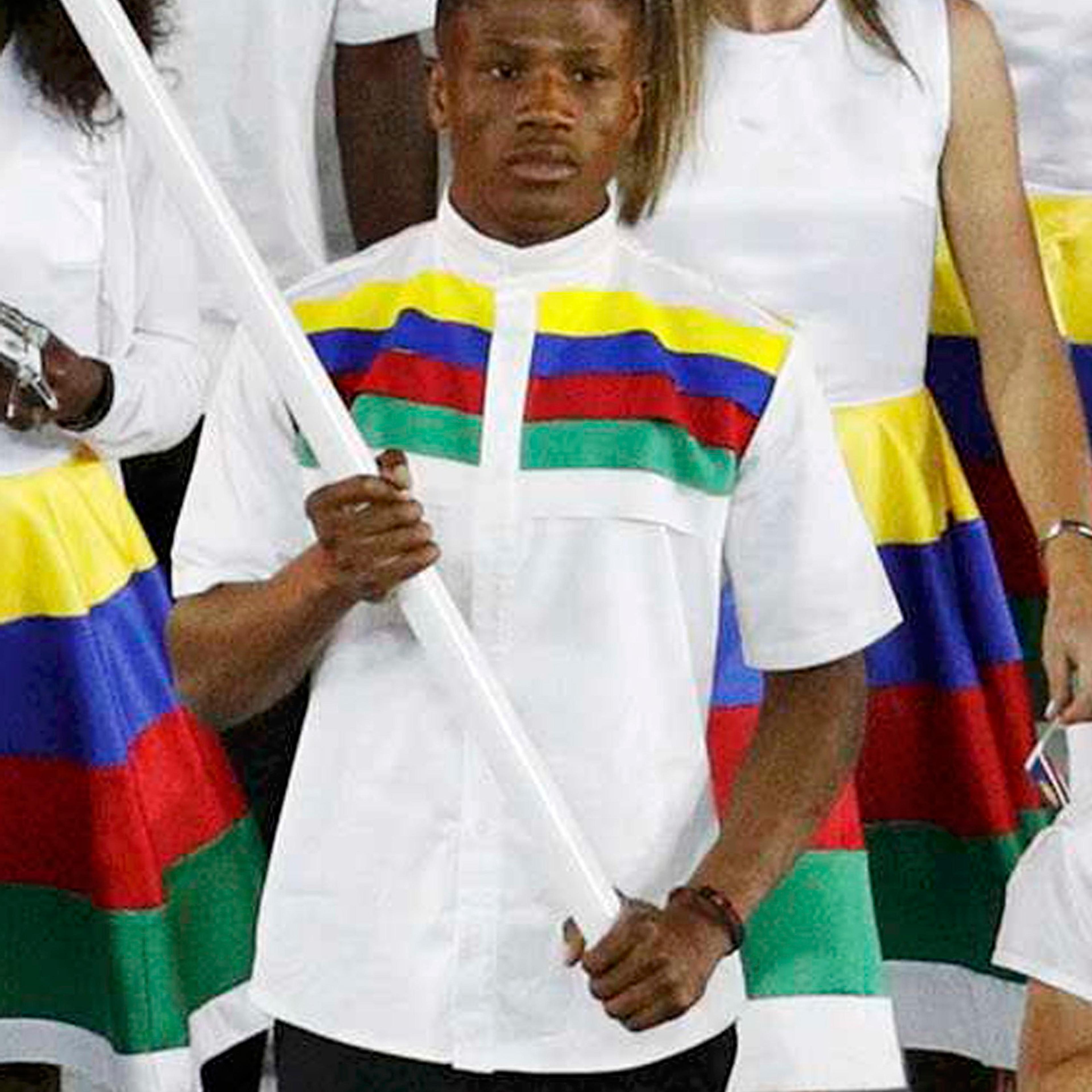 2016 Rio Olympics - Maracana - Rio de Janeiro, Brazil - 05/08/2016. Flagbearer Jonas Junius (NAM) of Namibia leads his contingent during the opening ceremony. Brazilian police have arrested Junius on suspicion of attempting to secually assault a room mai