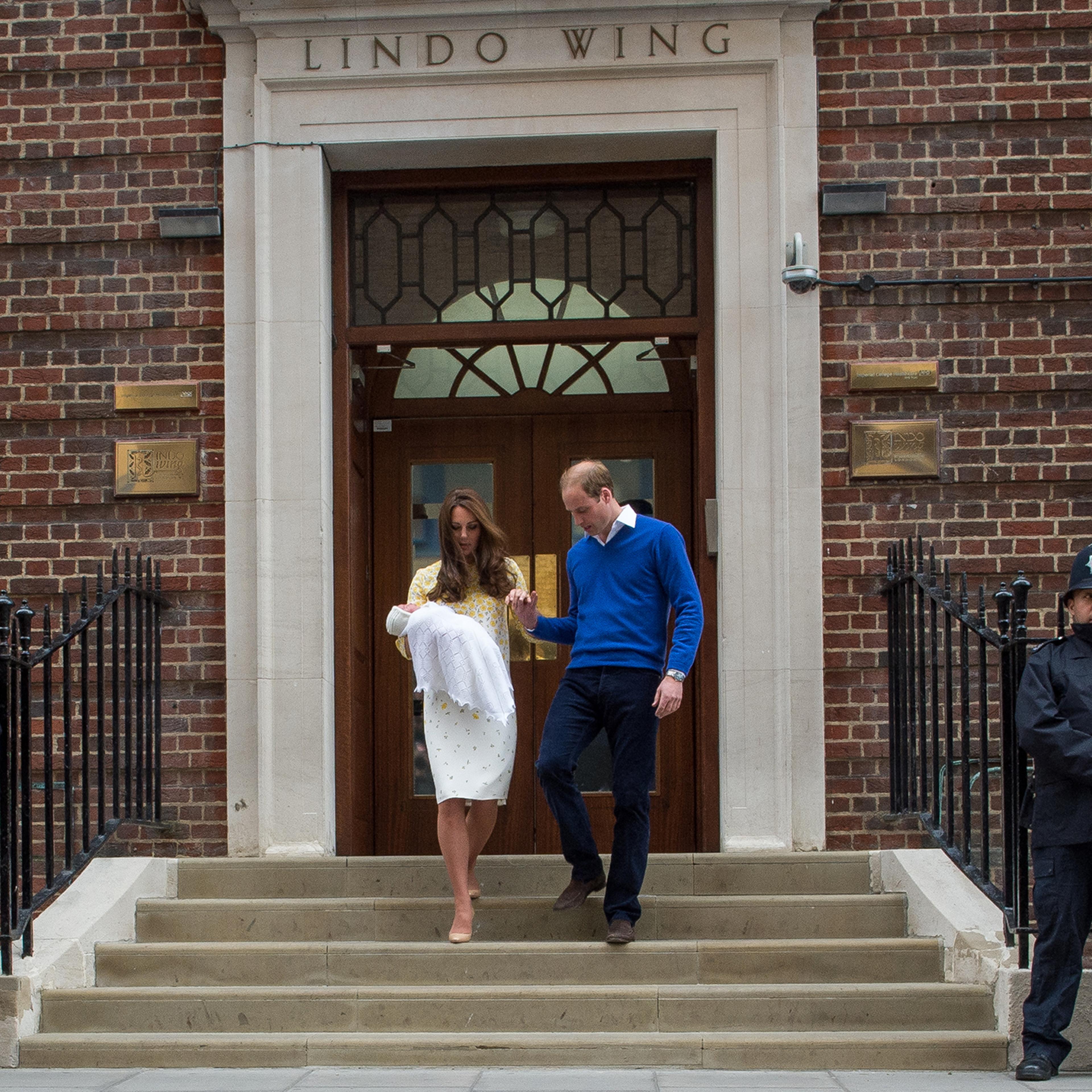 Prince William, Duke of Cambridge, and Catherine, Duchess of Cambridge, depart the Lindo Wing with their newborn baby daughter at St. Mary's Hospital in London on May 2, 2015.