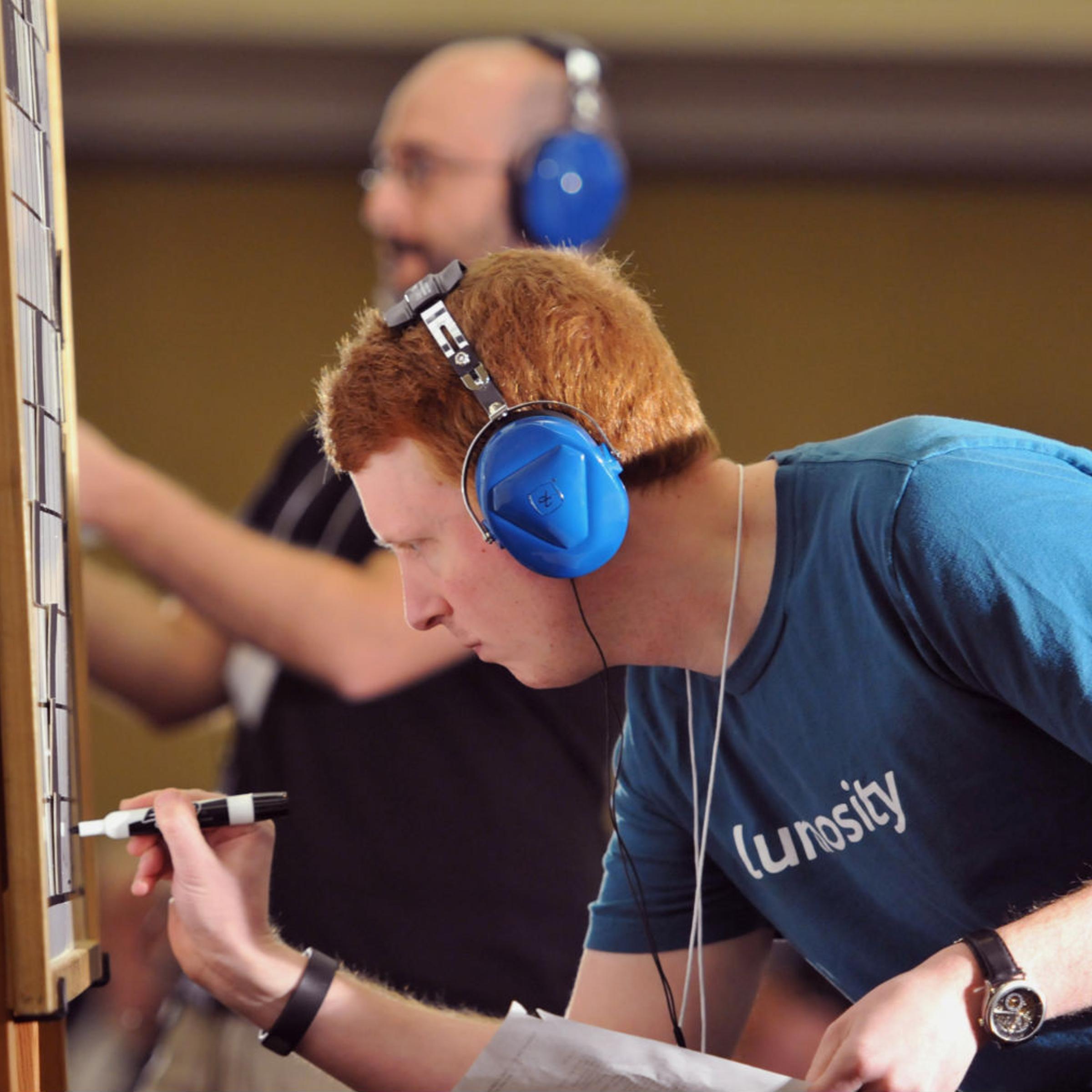Tyler Hinman (foreground) battles rival Dan Feyer in the final of the American Crossword Puzzle Tournament in New York City on March 9, 2014.