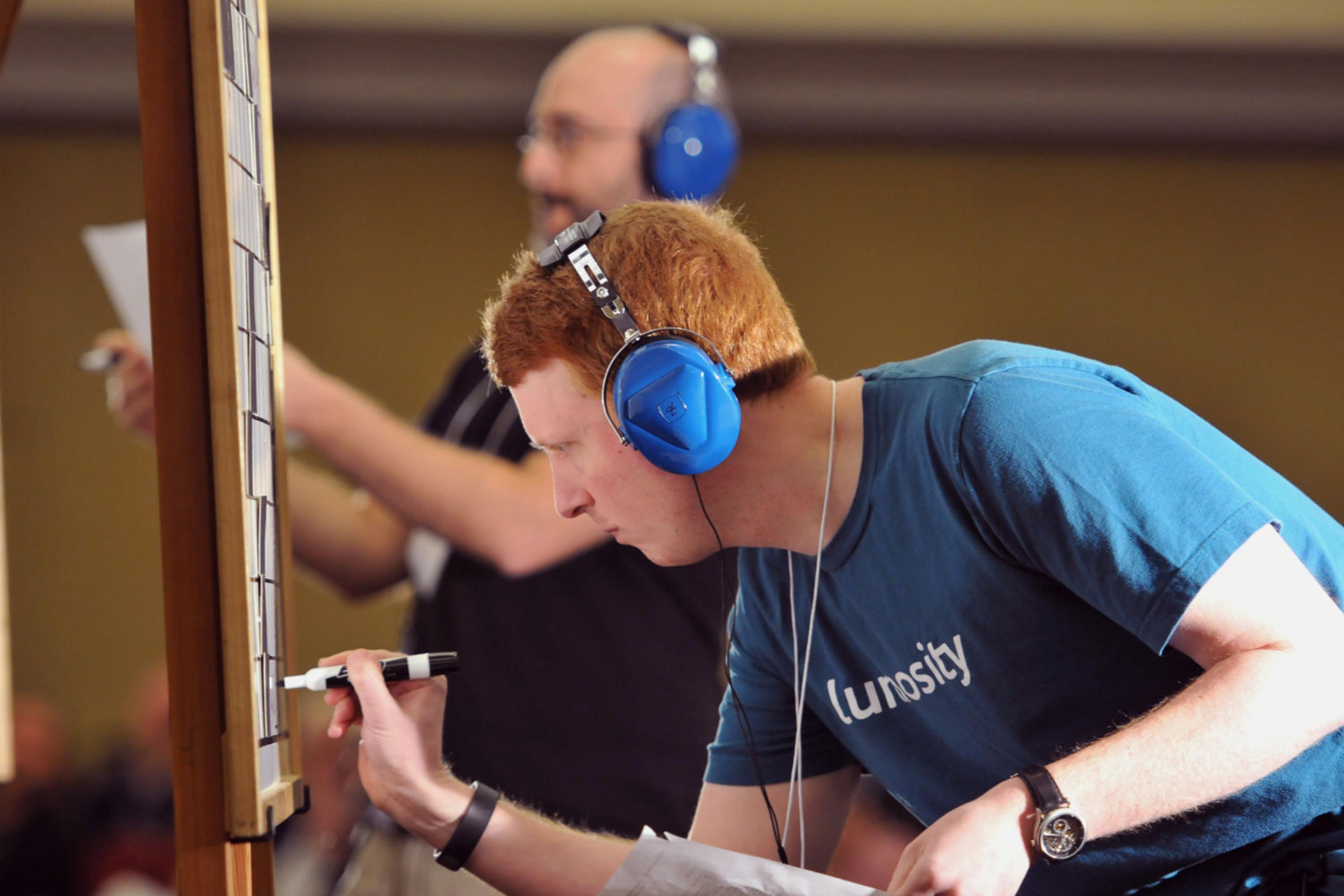Tyler Hinman (foreground) battles rival Dan Feyer in the final of the American Crossword Puzzle Tournament in New York City on March 9, 2014.