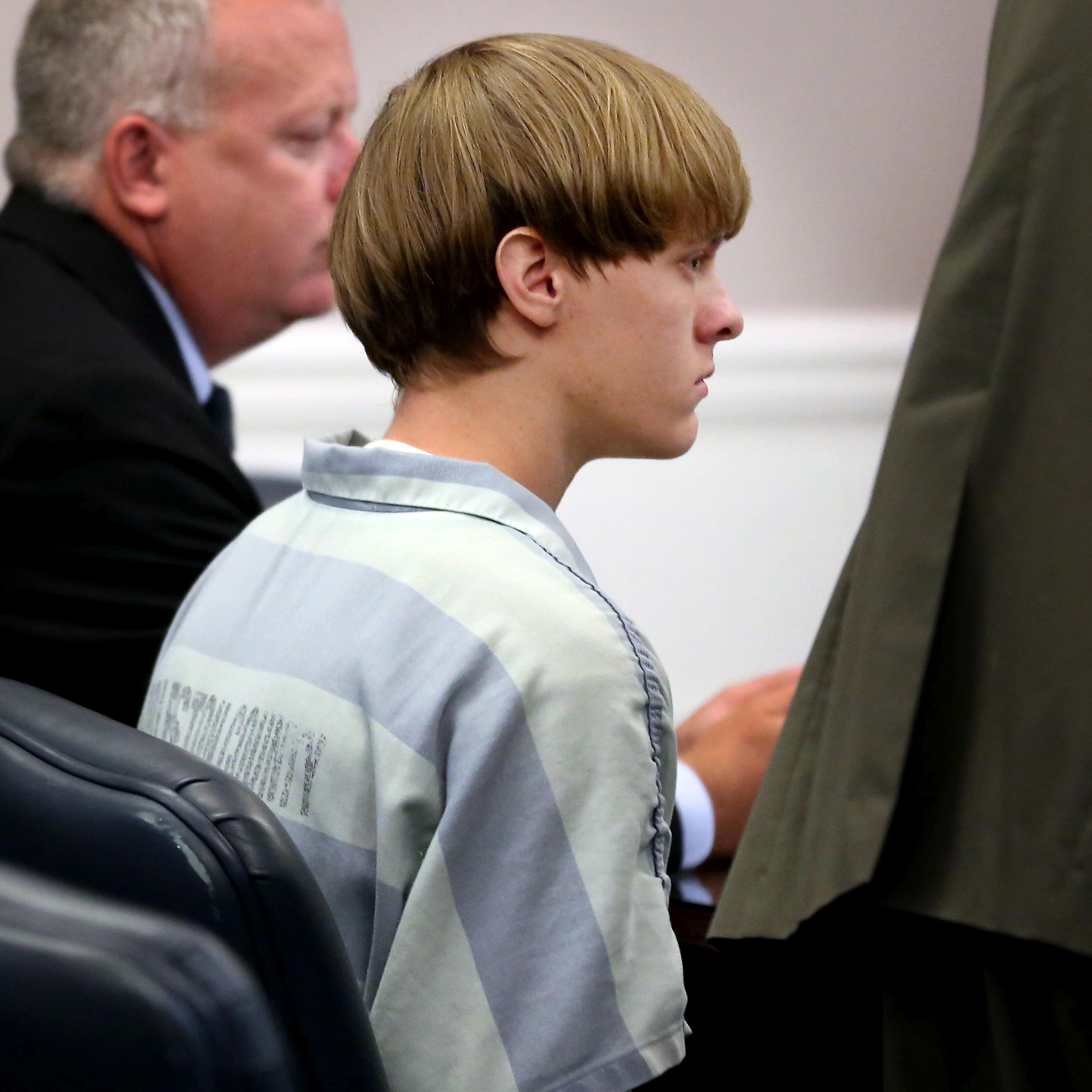 Dylan Roof (C), the suspect in the mass shooting that left nine dead in a Charleston church appears in court in Charleston, S.C., on July 18, 2015.