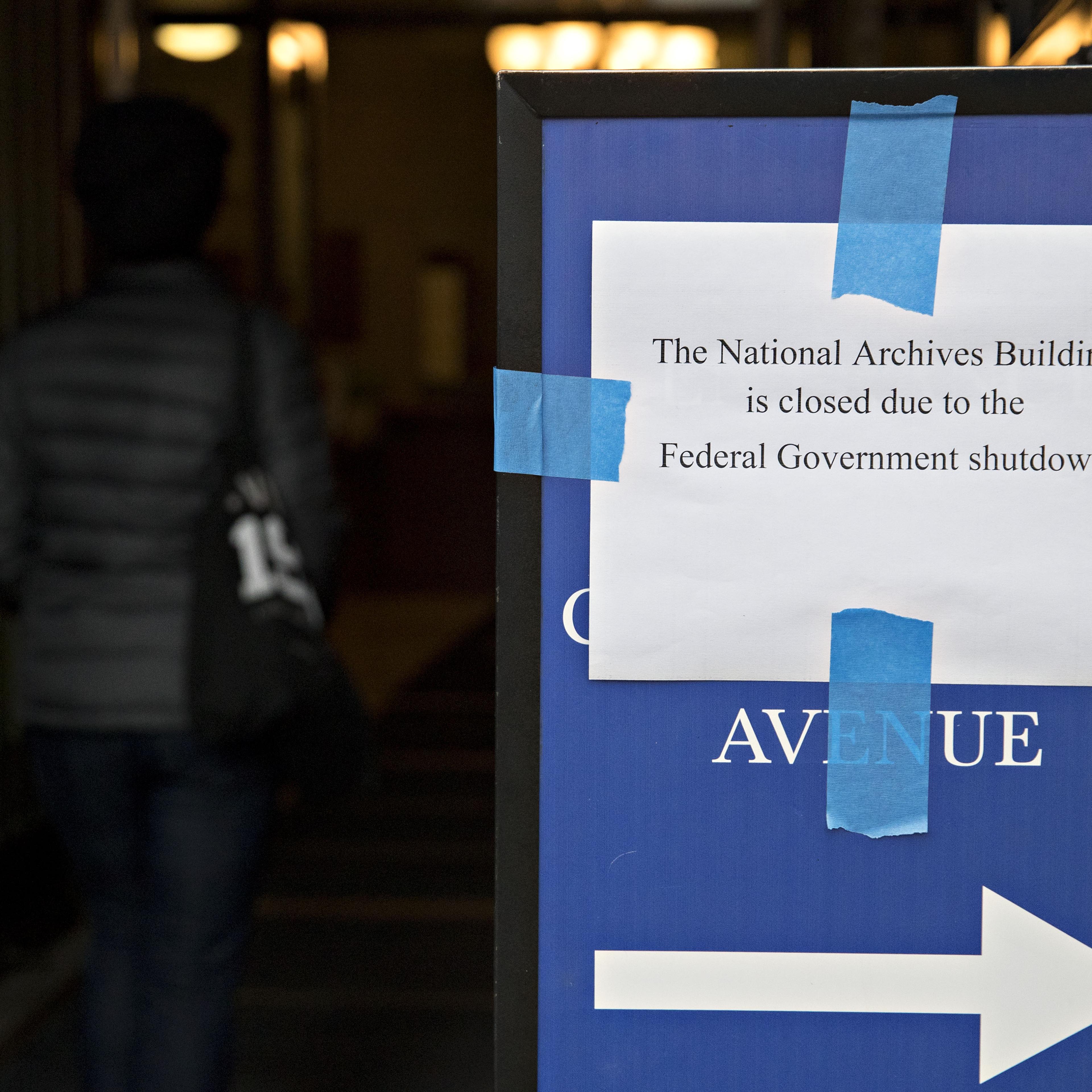 A sign indicating that the National Archives Building is closed due to the federal government shutdown stands outside the building in Washington, D.C., U.S., on Monday, Jan. 22, 2018.