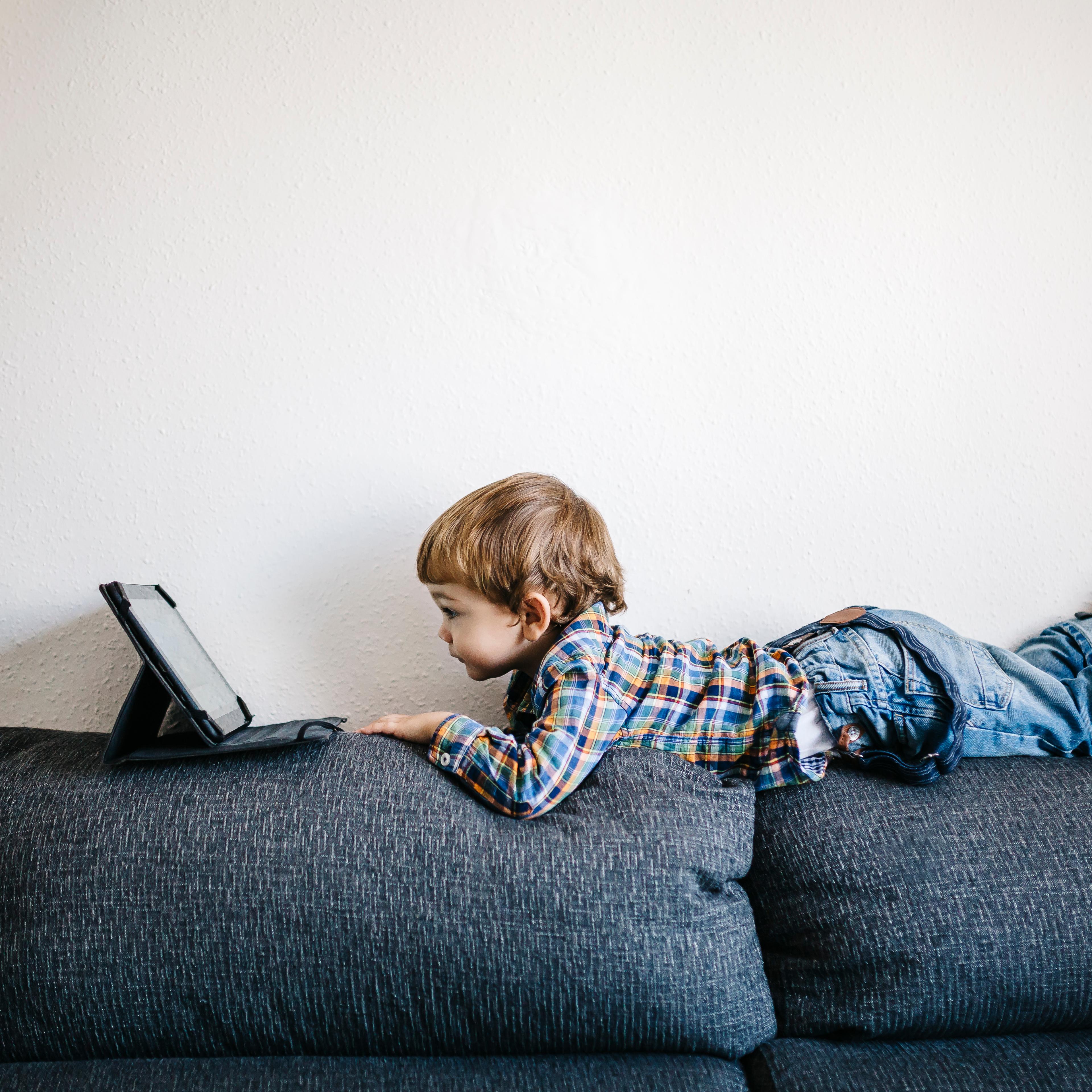 boy-watching-tablet-couch