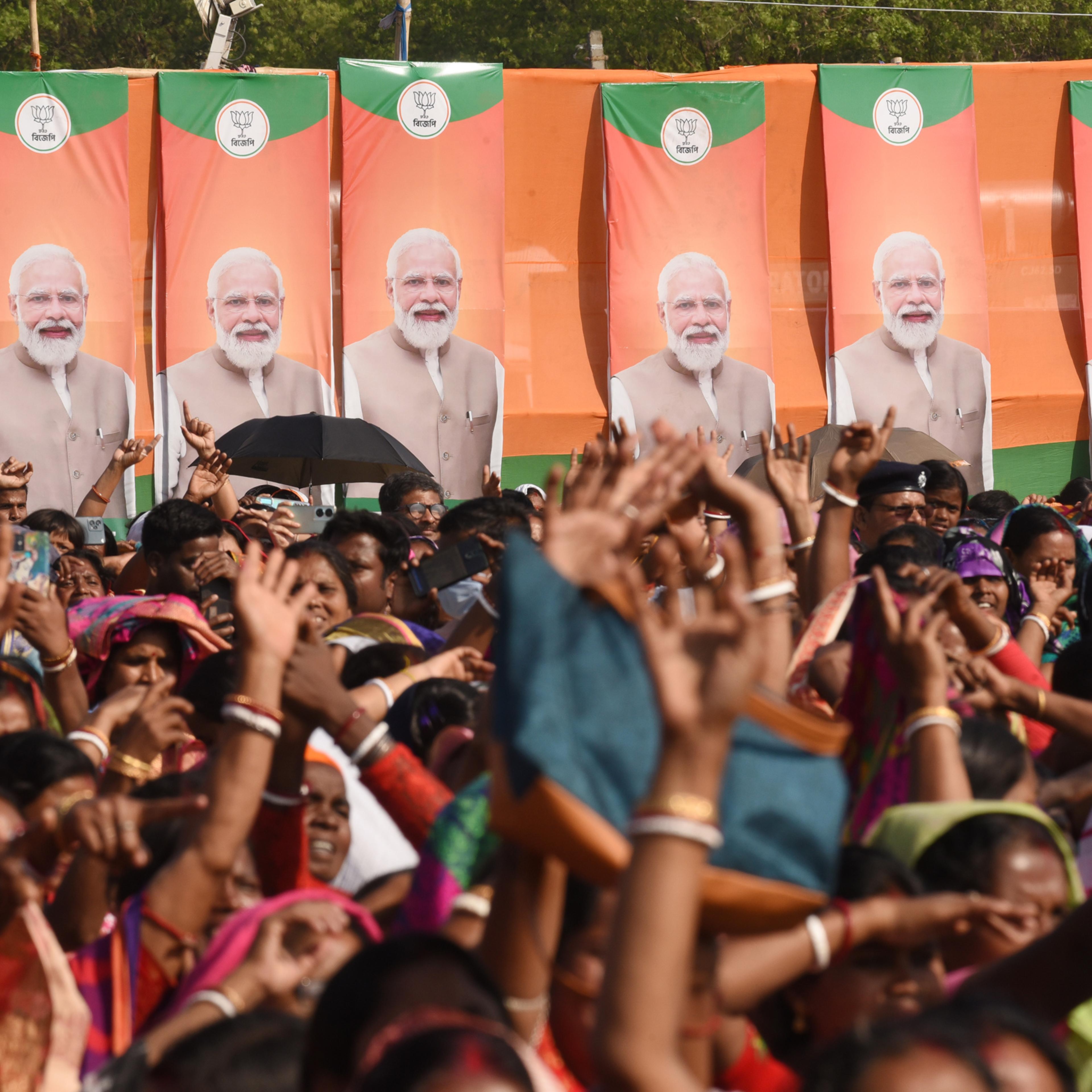 BJP supporters greet Prime Minister Narendra Modi during a rally in Arambagh, India, on March 1.