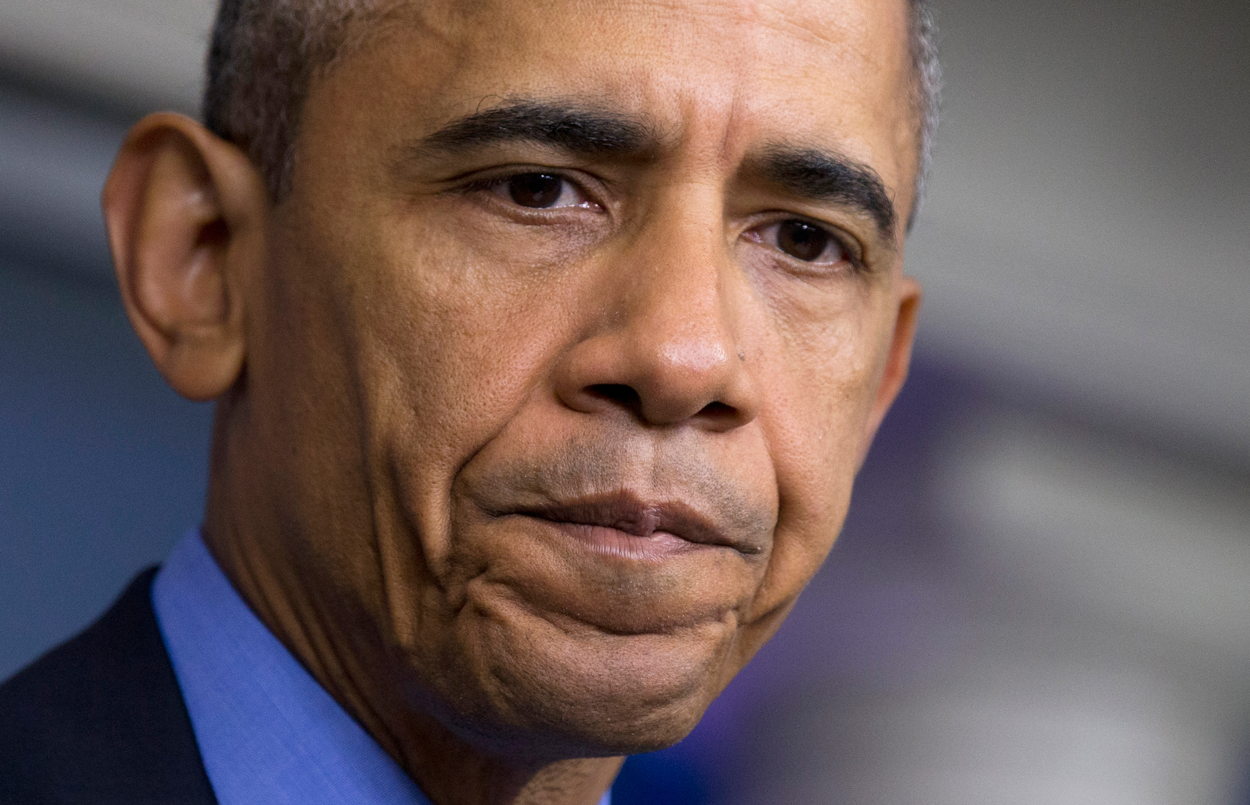 FILE - In this June 18, 2015 photo, President Barack Obama pauses while speaking in the Brady Press Briefing Room of the White House in Washington, on the church shooting in Charleston, S.C., prior to his departure to Los Angeles. After nine black parish