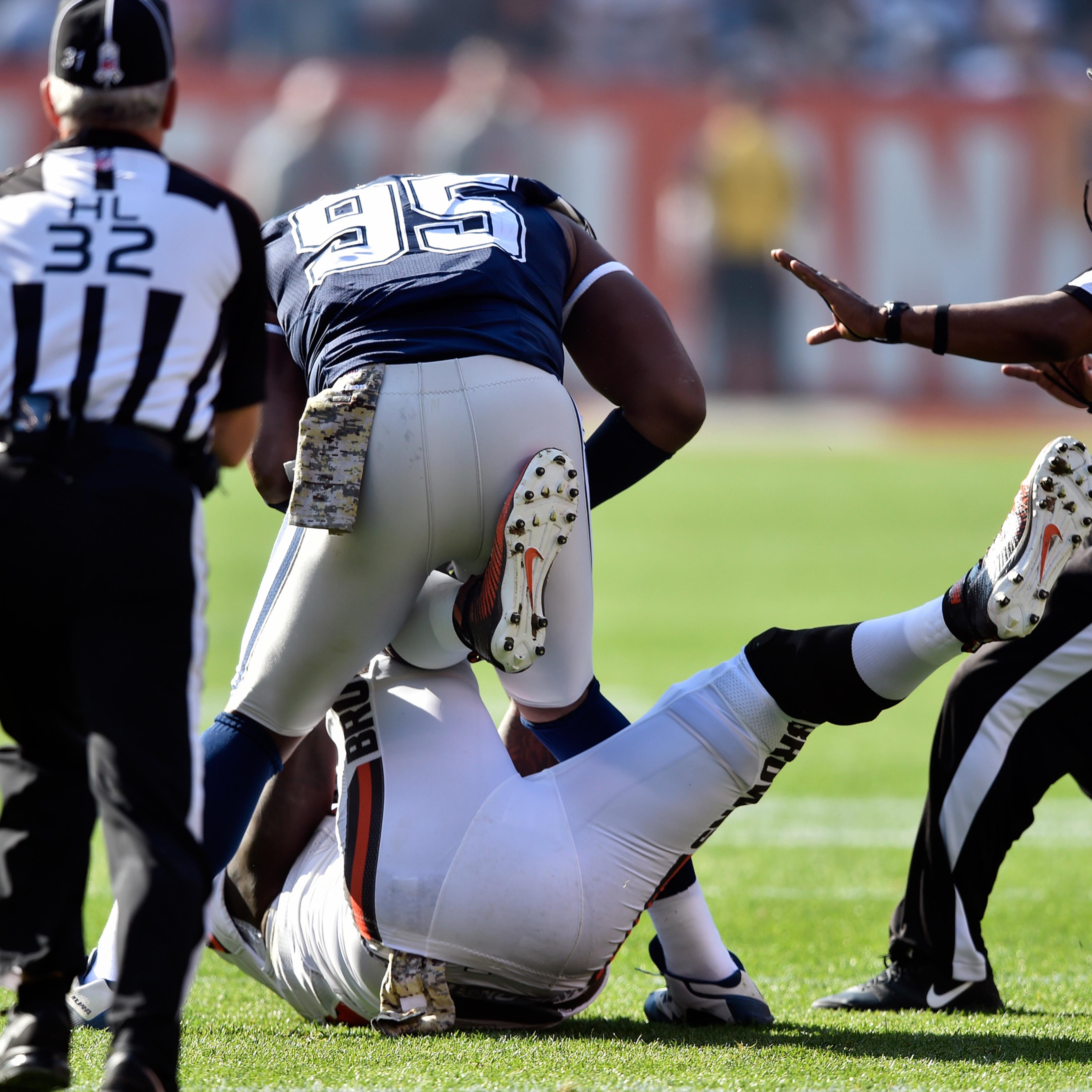 Dallas Cowboys defensive tackle David Irving (95) and Cleveland Browns center Cameron Erving, bottom, fight in the first half of an NFL football game, Sunday, Nov. 6, 2016, in Cleveland. (AP Photo/David Richard)