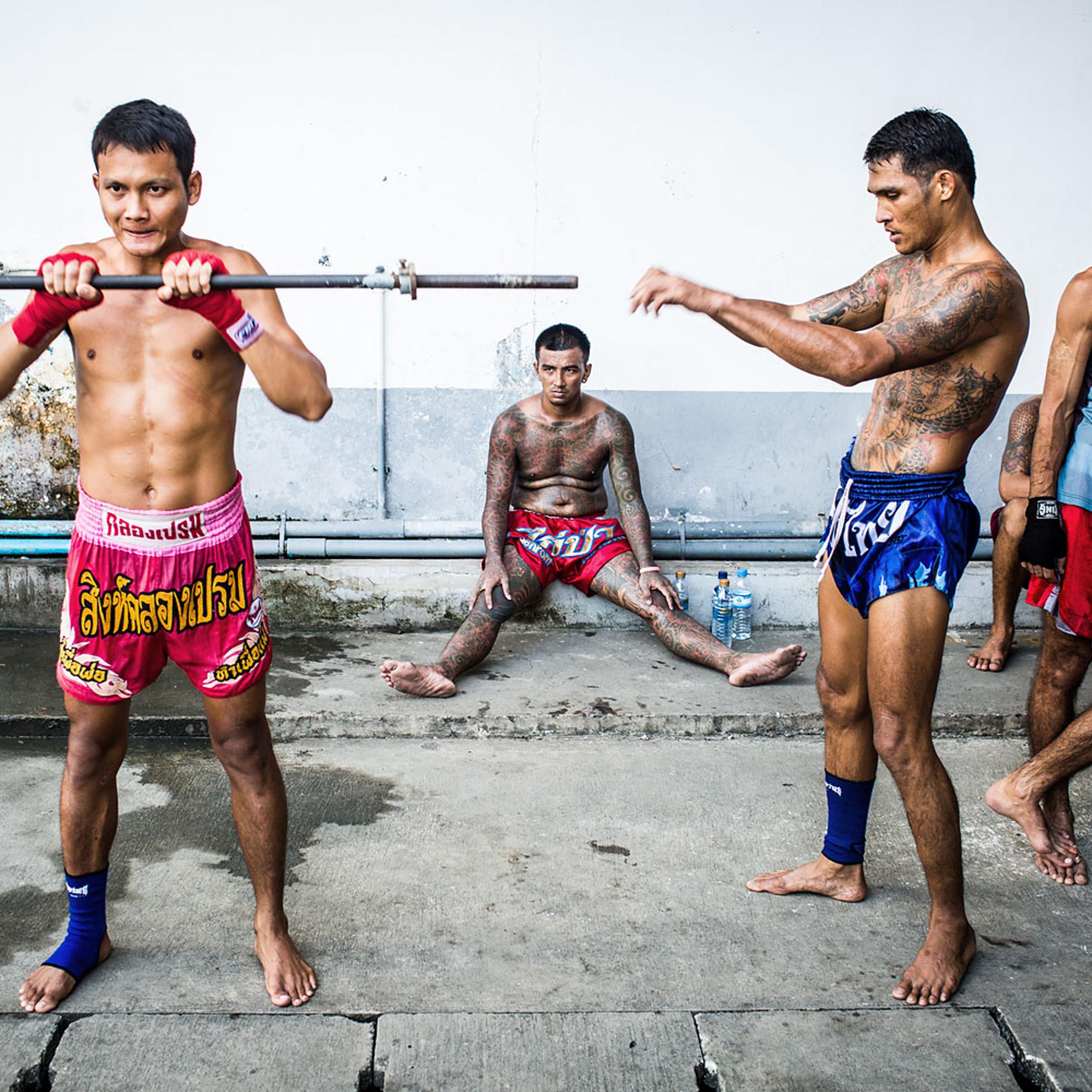 Moo, 23, builds muscle for Muay Thai on the Klong Prem prison yard, in Bangkok, Nov. 2013.