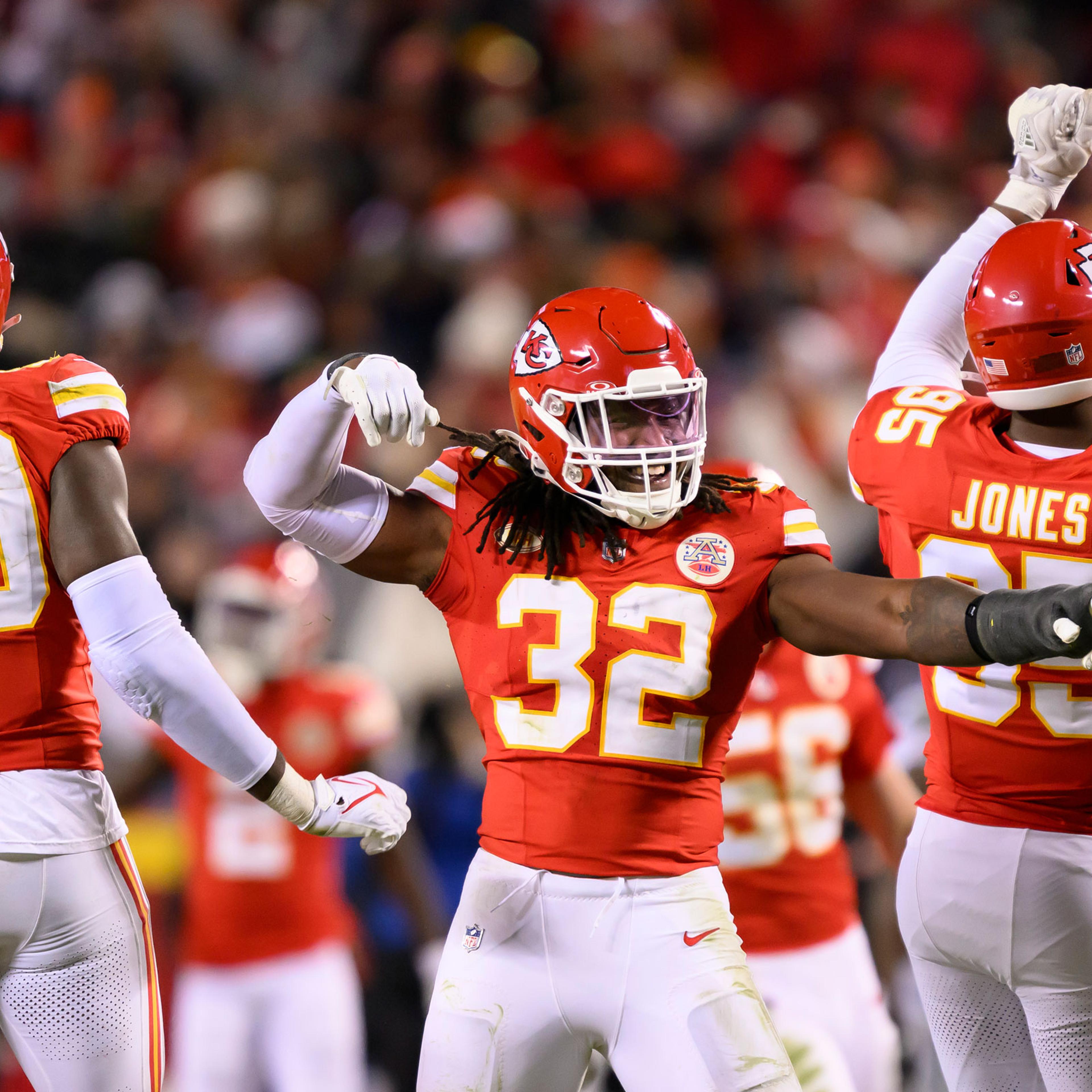 Kansas City Chiefs defensive players Charles Omenihu, Nick Bolton, and Chris Jones celebrate a sack