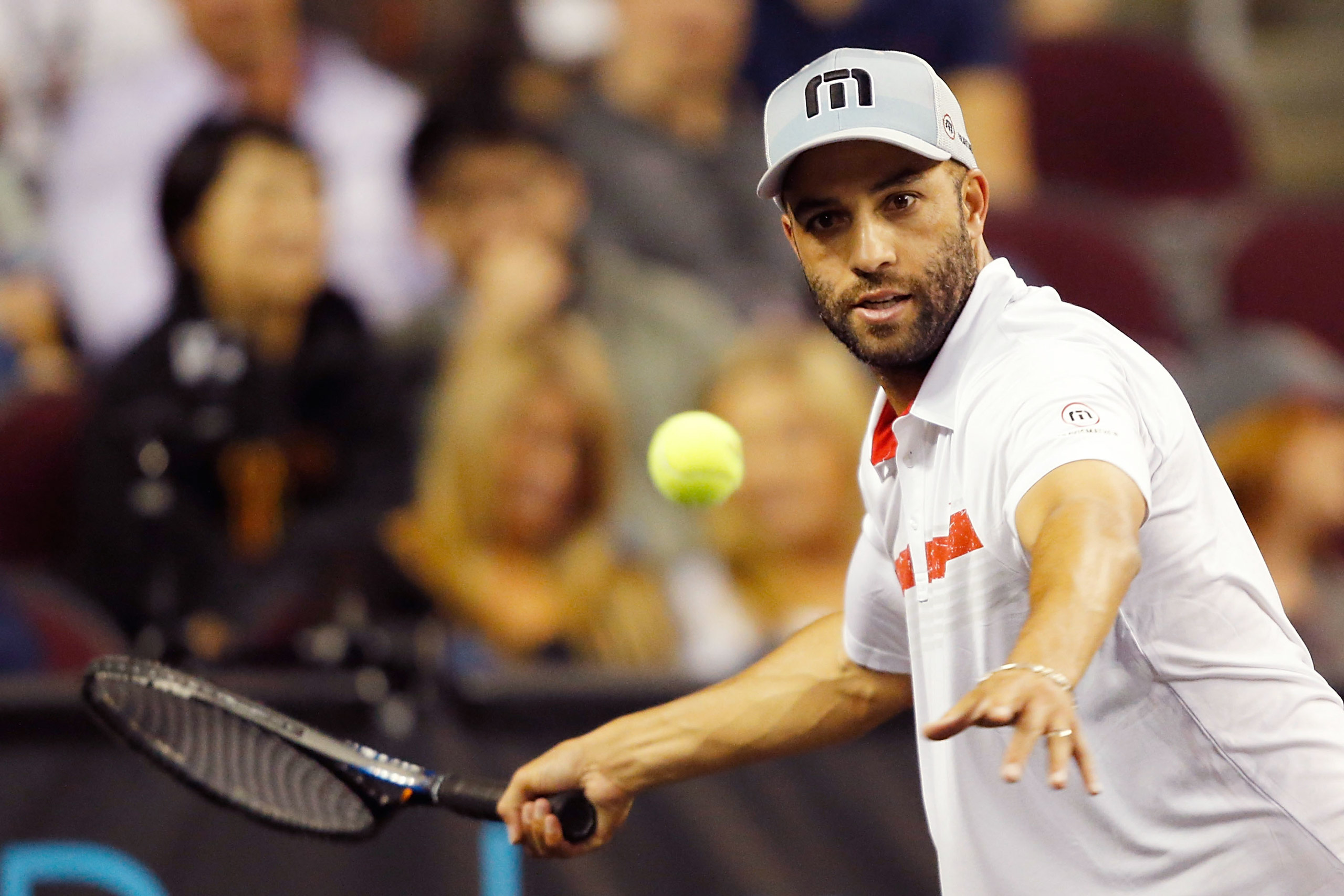 LOS ANGELES, CA - MARCH 25: James Blake returns a shot to Andy Roddick during the PowerShares Series SoCal Honda Dealers Helpful Cup at Galen Center on March 25, 2015 in Los Angeles, California. (Photo by Joe Scarnici/Getty Images)