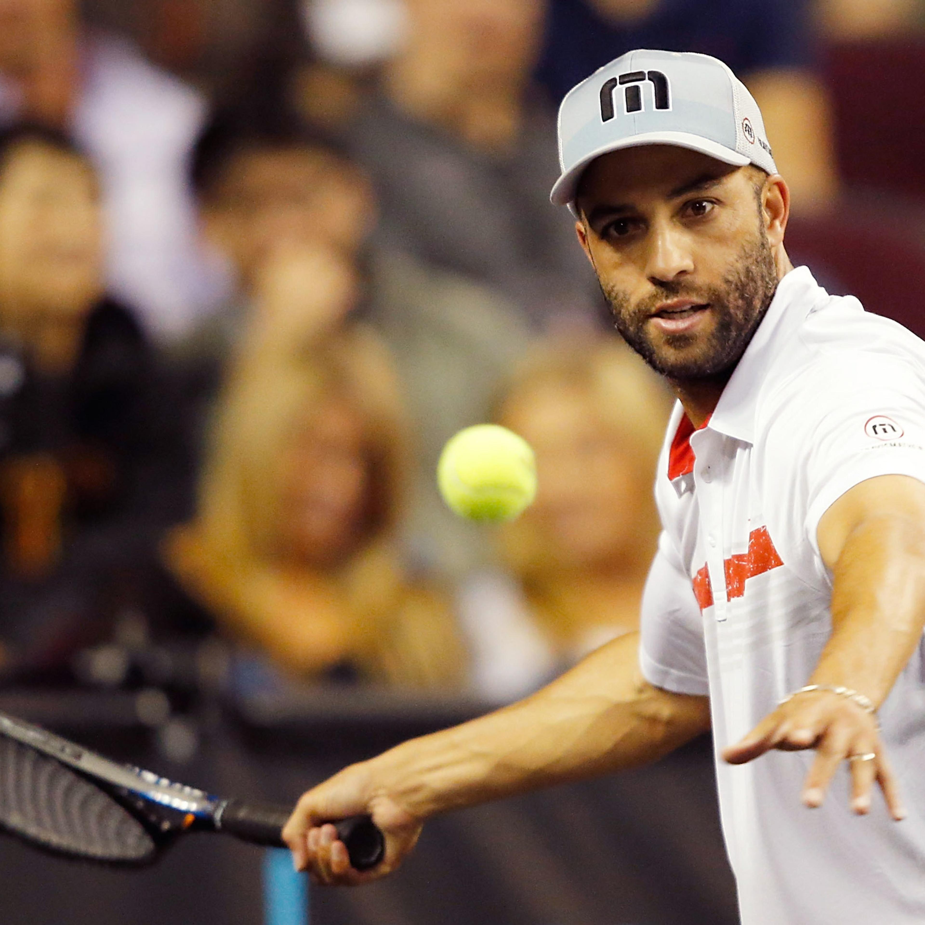 LOS ANGELES, CA - MARCH 25: James Blake returns a shot to Andy Roddick during the PowerShares Series SoCal Honda Dealers Helpful Cup at Galen Center on March 25, 2015 in Los Angeles, California. (Photo by Joe Scarnici/Getty Images)