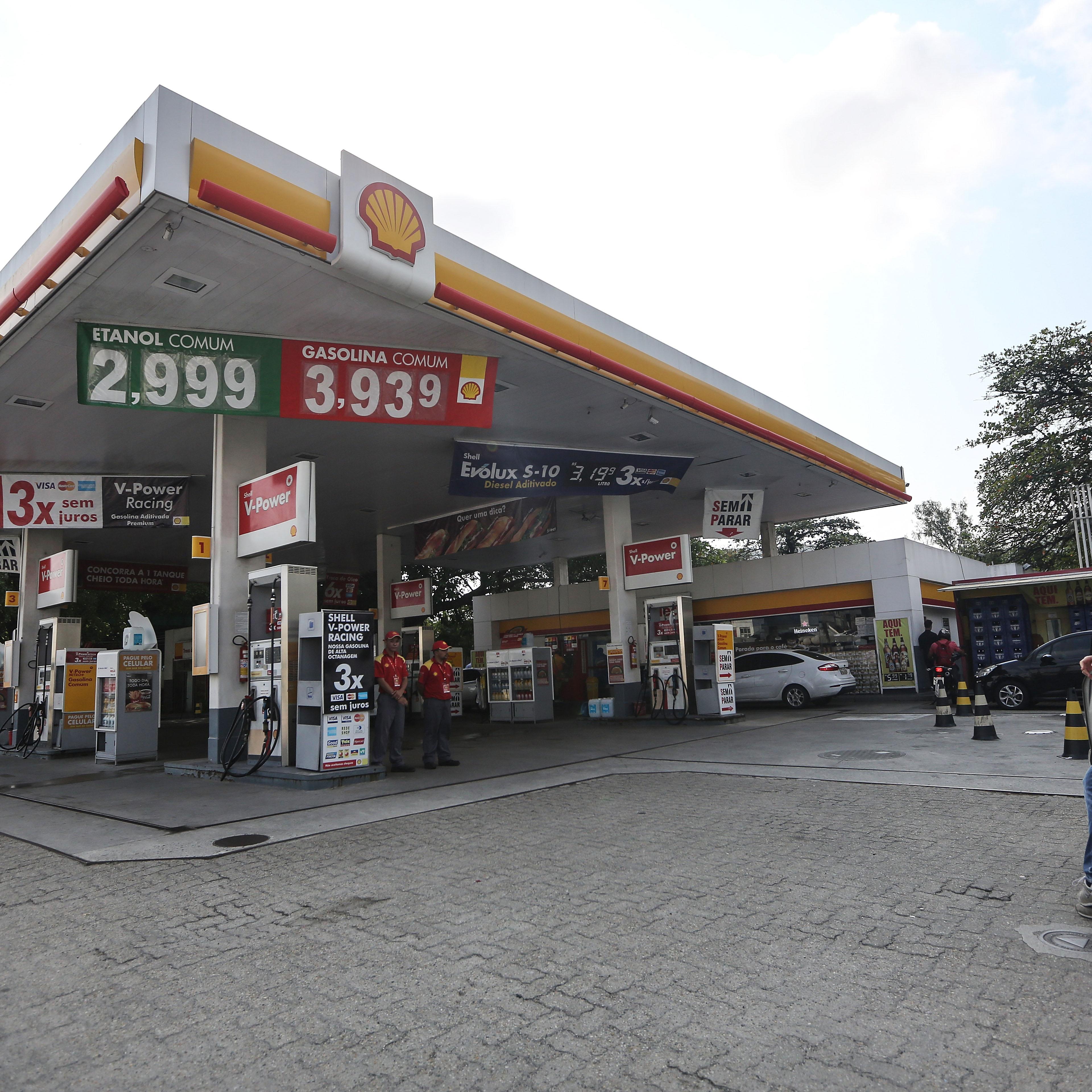 People gather at the Shell gas station where four U.S. Olympic swimmers were captured on security video in Rio de Janeiro, Brazil, on Aug. 18, 2016.