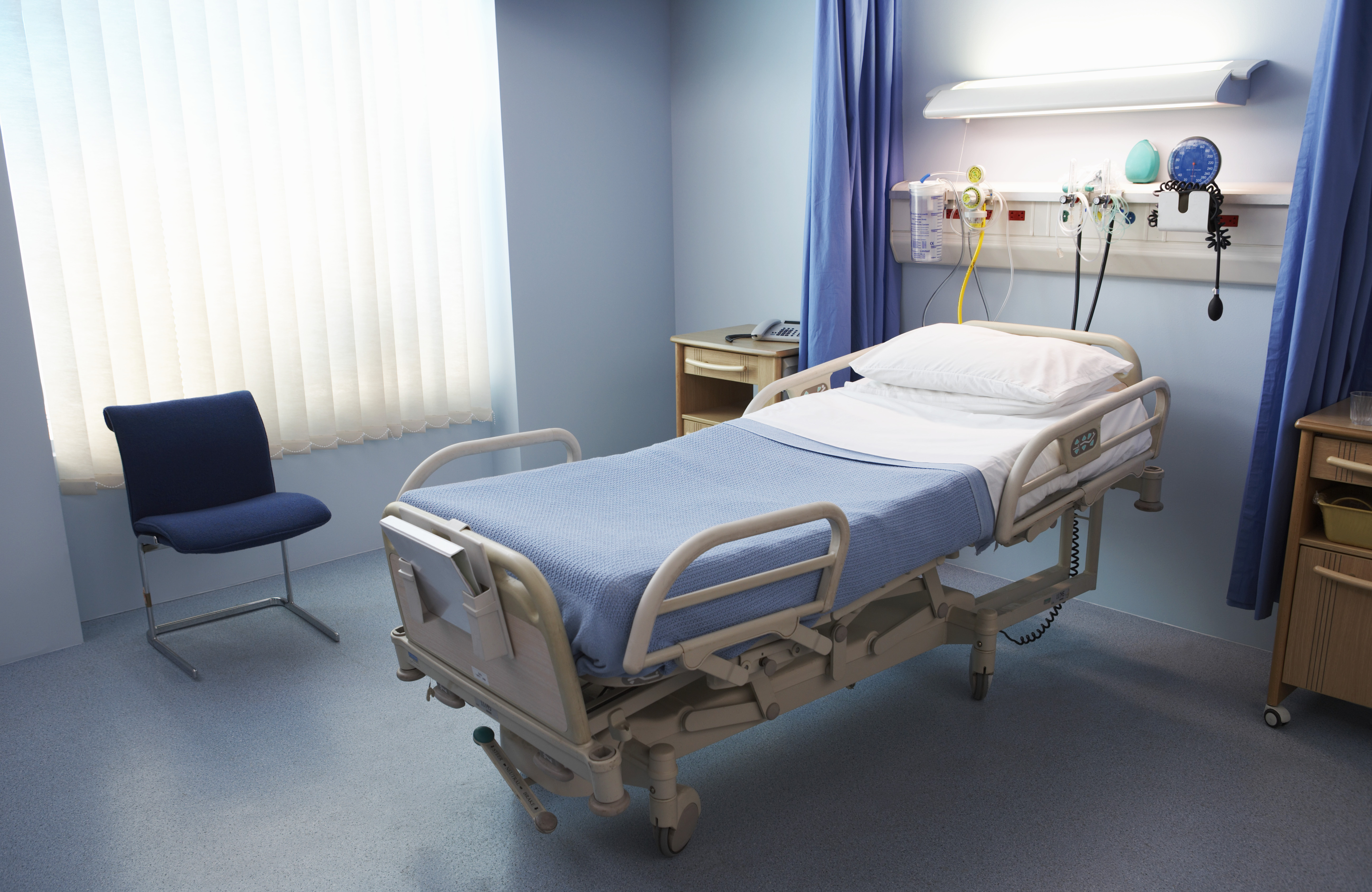 Empty Hospital Bed in a Ward