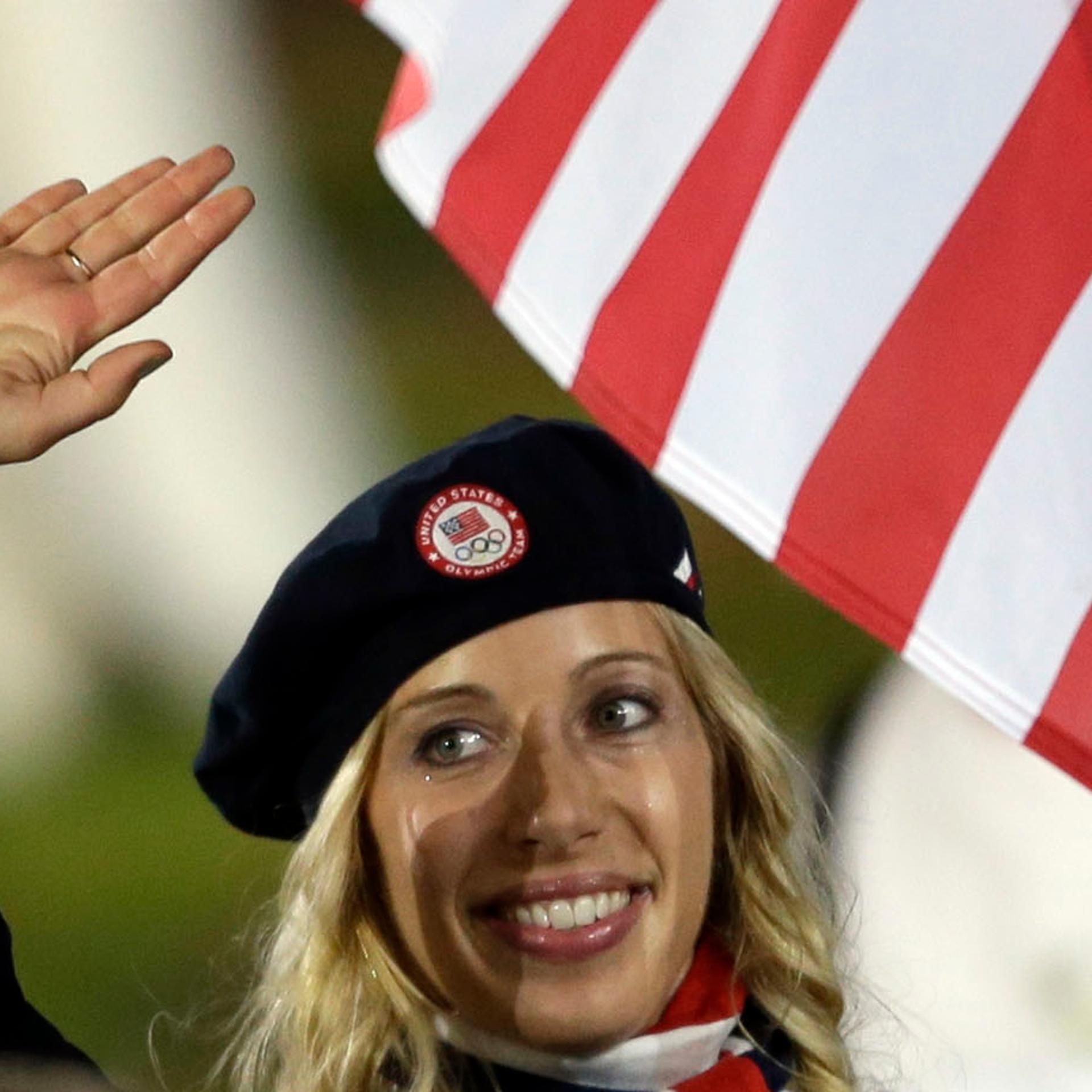 United States's fencer Mariel Zagunis carries the flag during the Opening Ceremony at the 2012 Summer Olympics, Friday, July 27, 2012, in London.