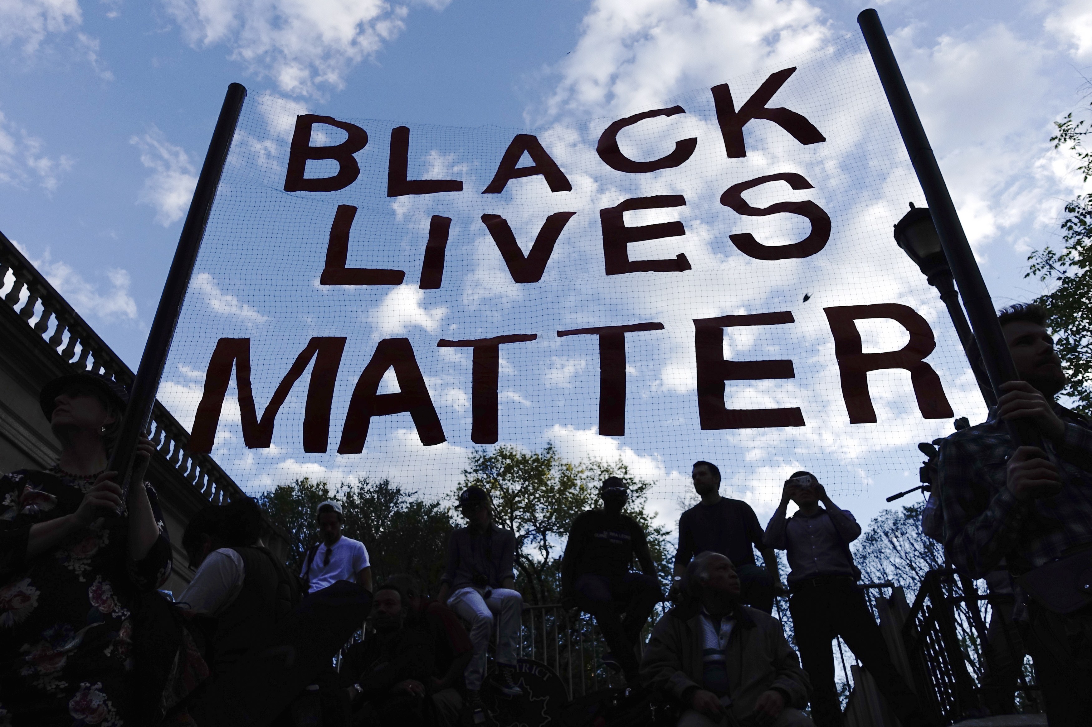 People take part in a rally on April 29, 2015 at Union Square in New York, held in solidarity with demonstrators in Baltimore, Maryland demanding justice for an African-American man who died of severe spinal injuries sustained in police custody.