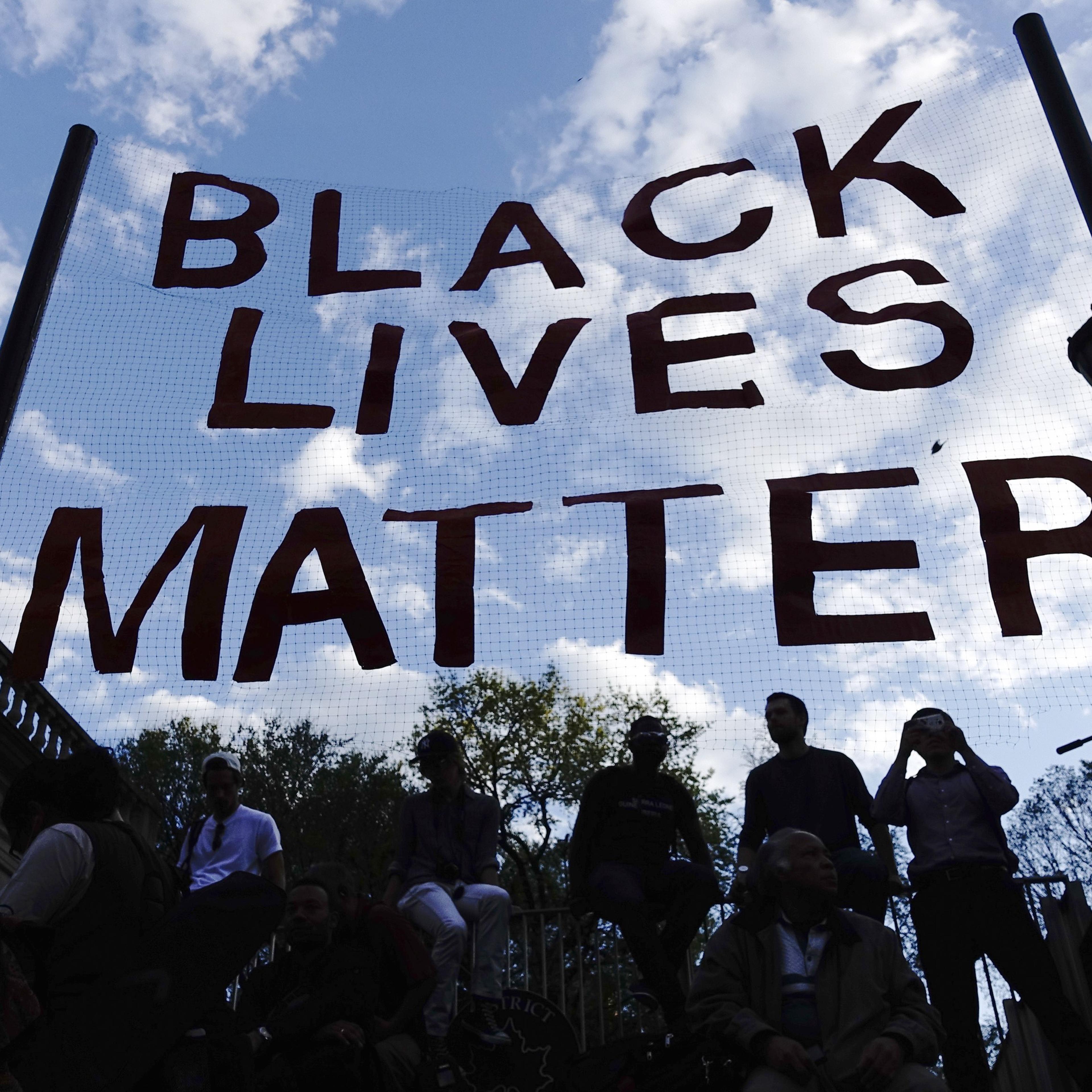 People take part in a rally on April 29, 2015 at Union Square in New York, held in solidarity with demonstrators in Baltimore, Maryland demanding justice for an African-American man who died of severe spinal injuries sustained in police custody.