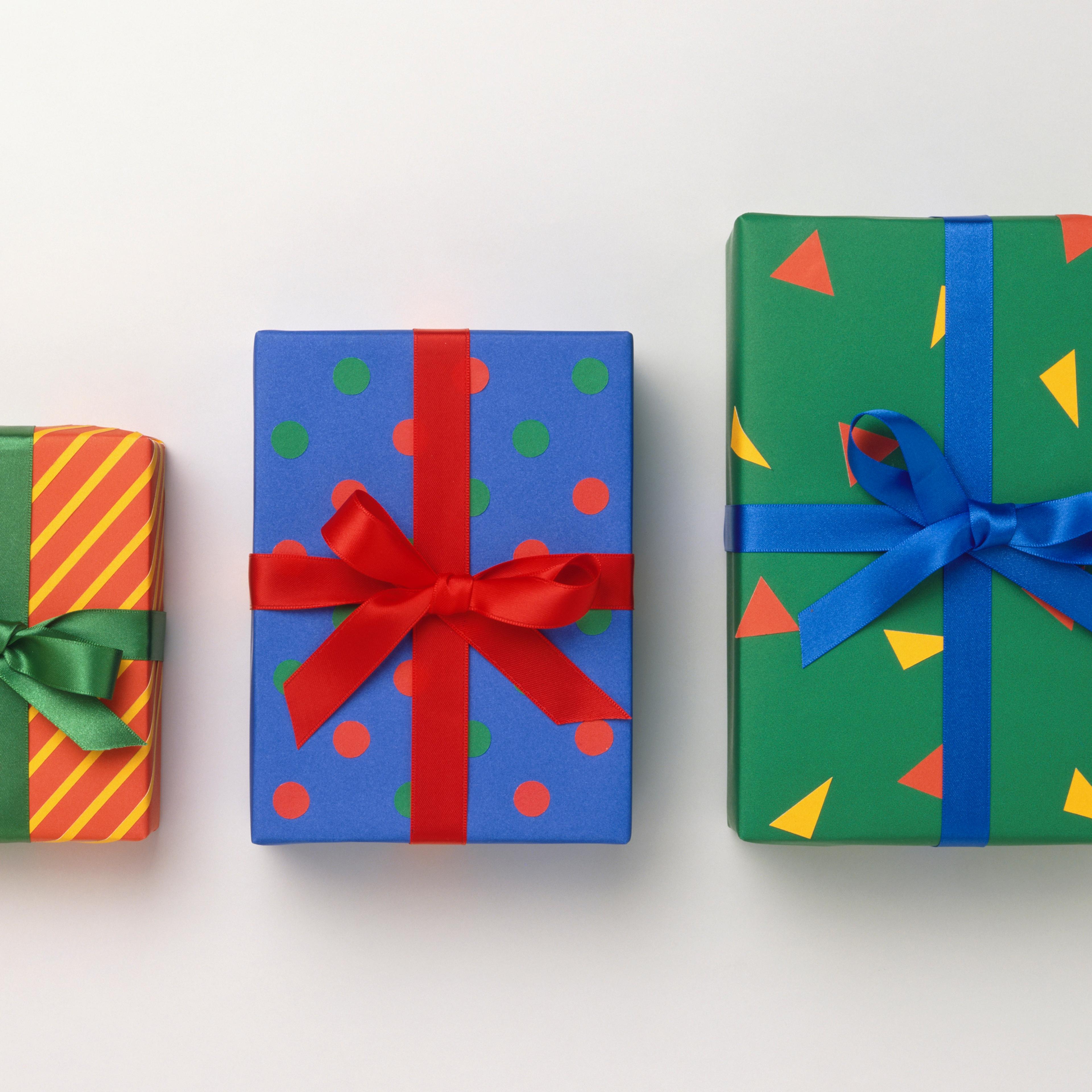 Three colourfully wrapped, different size boxes.