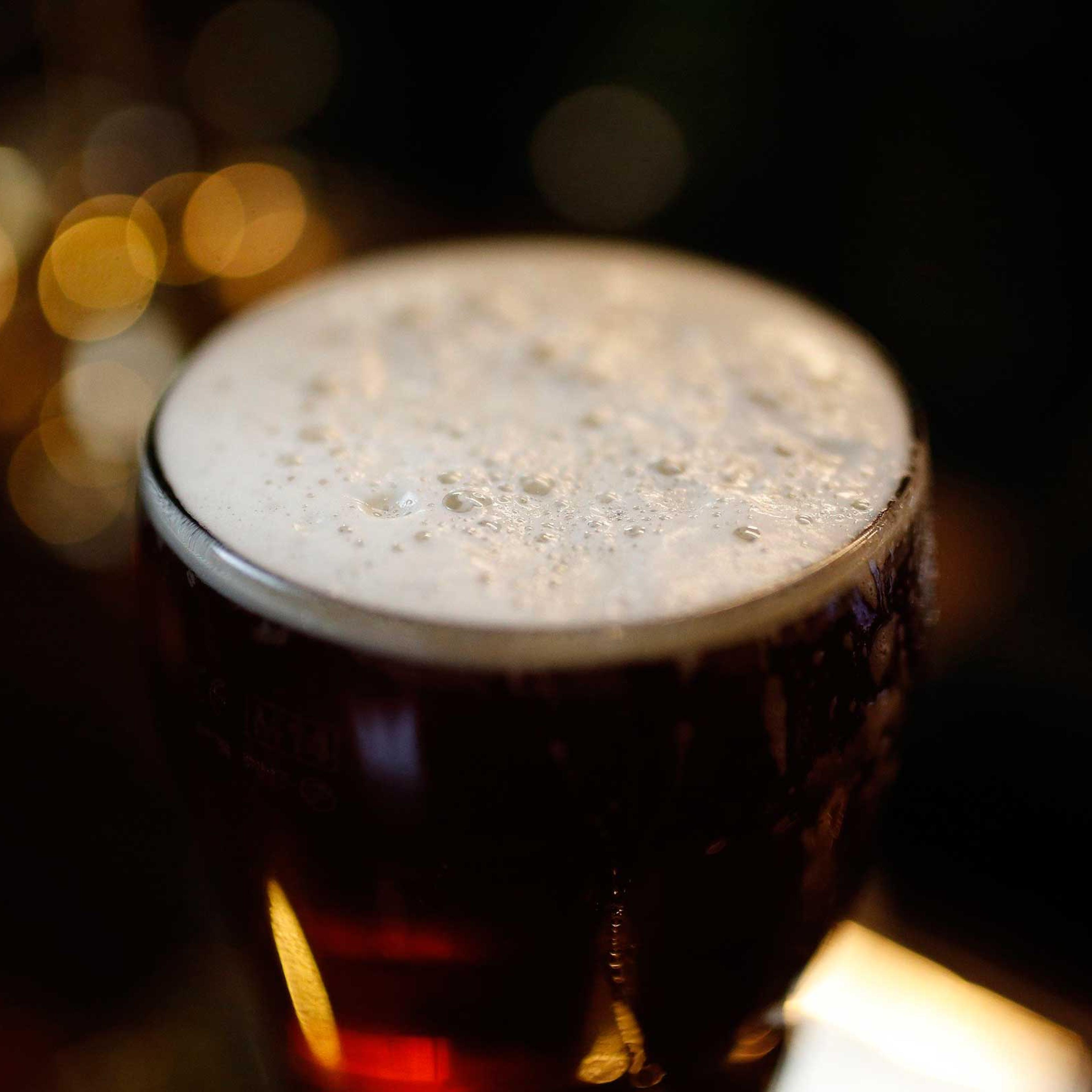A pint of beer stands on a bar in a pub in Liverpool northern England, Nov. 19 , 2014.