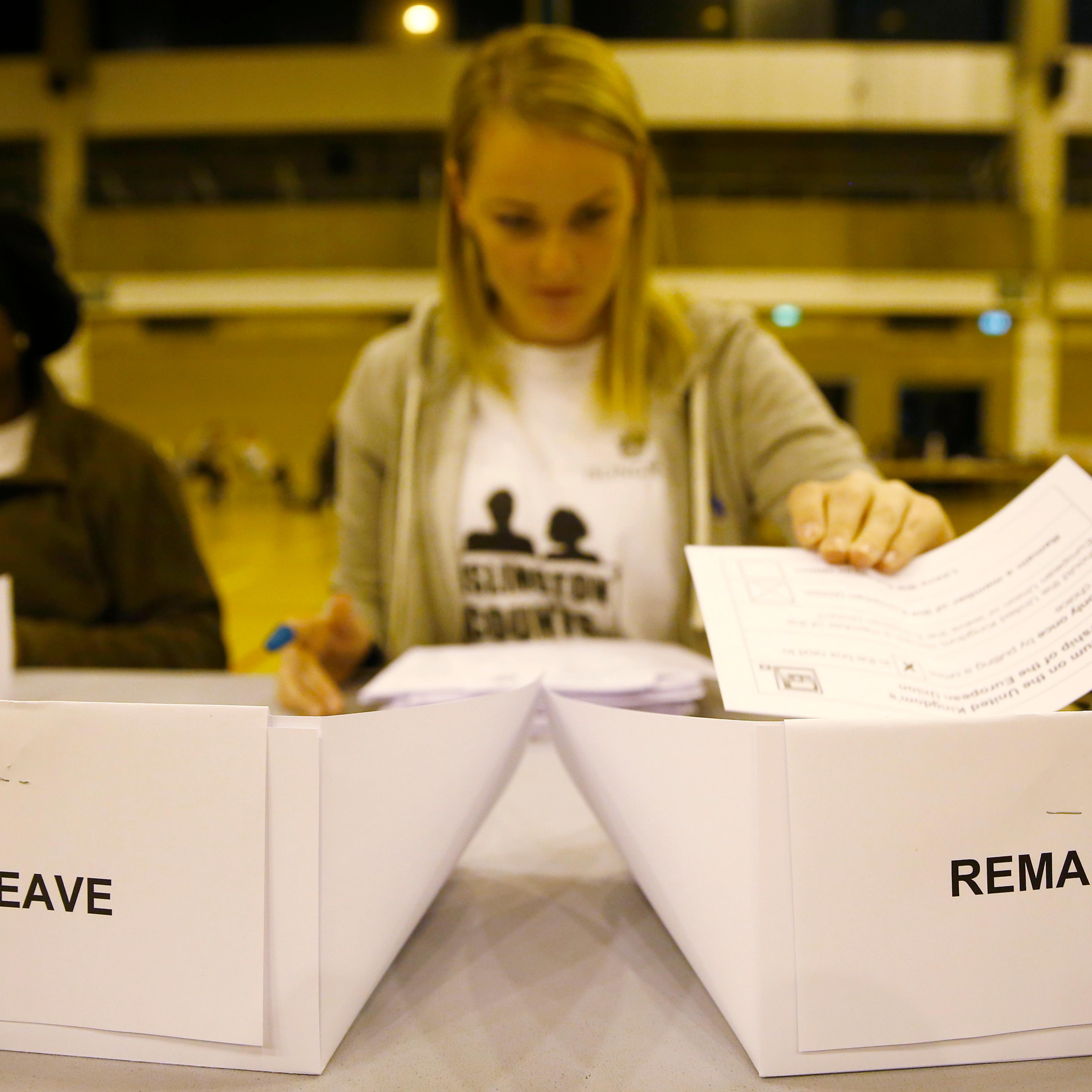 A workers counts ballots after polling stations closed in the Referendum on the European Union in Islington, London