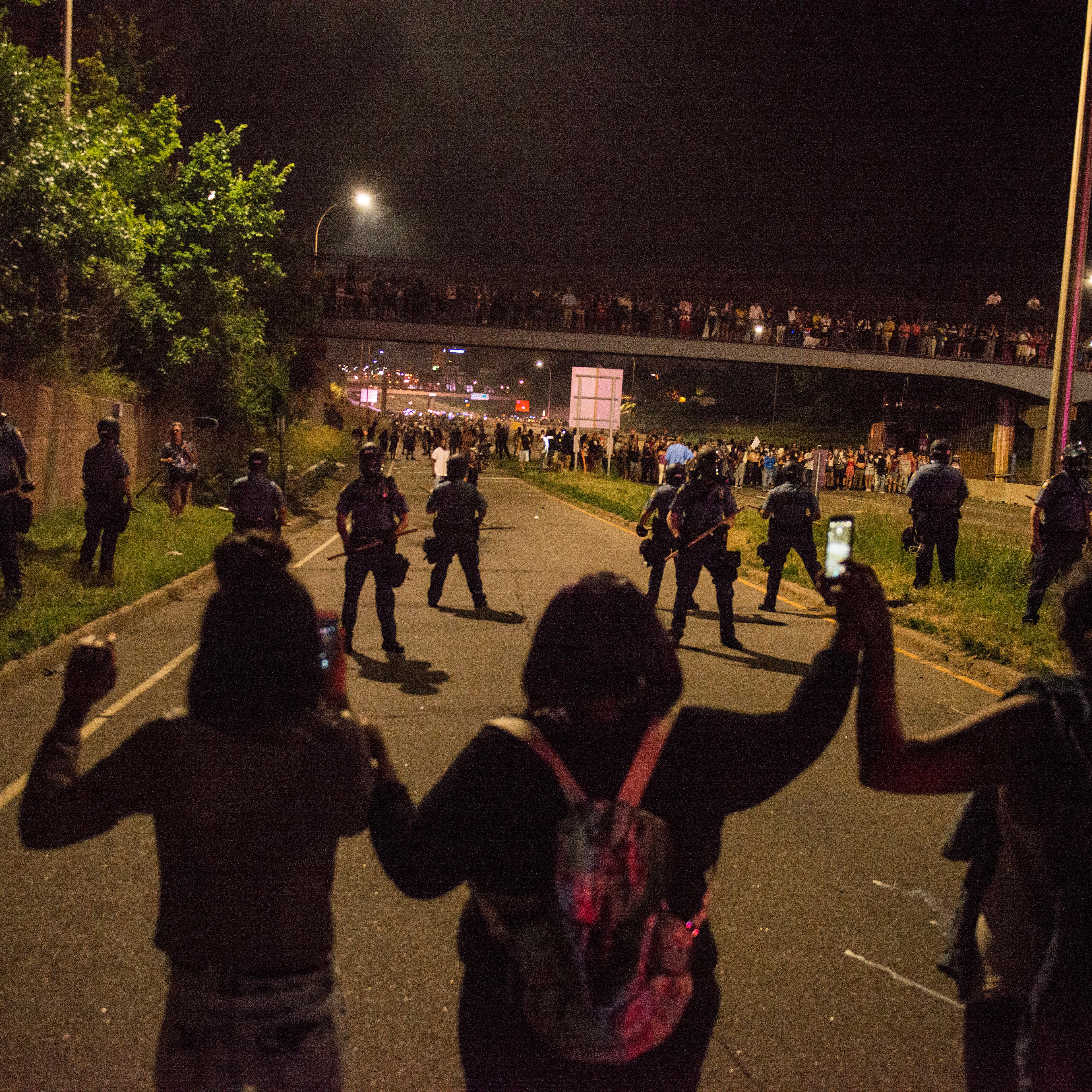 Protesters link hands on shut down highway I-94 on July 9, 2016 in St. Paul, Minnesota, in response to the police killing of Philando Castile on June 6, 2016 in Falcon Heights, Minnesota