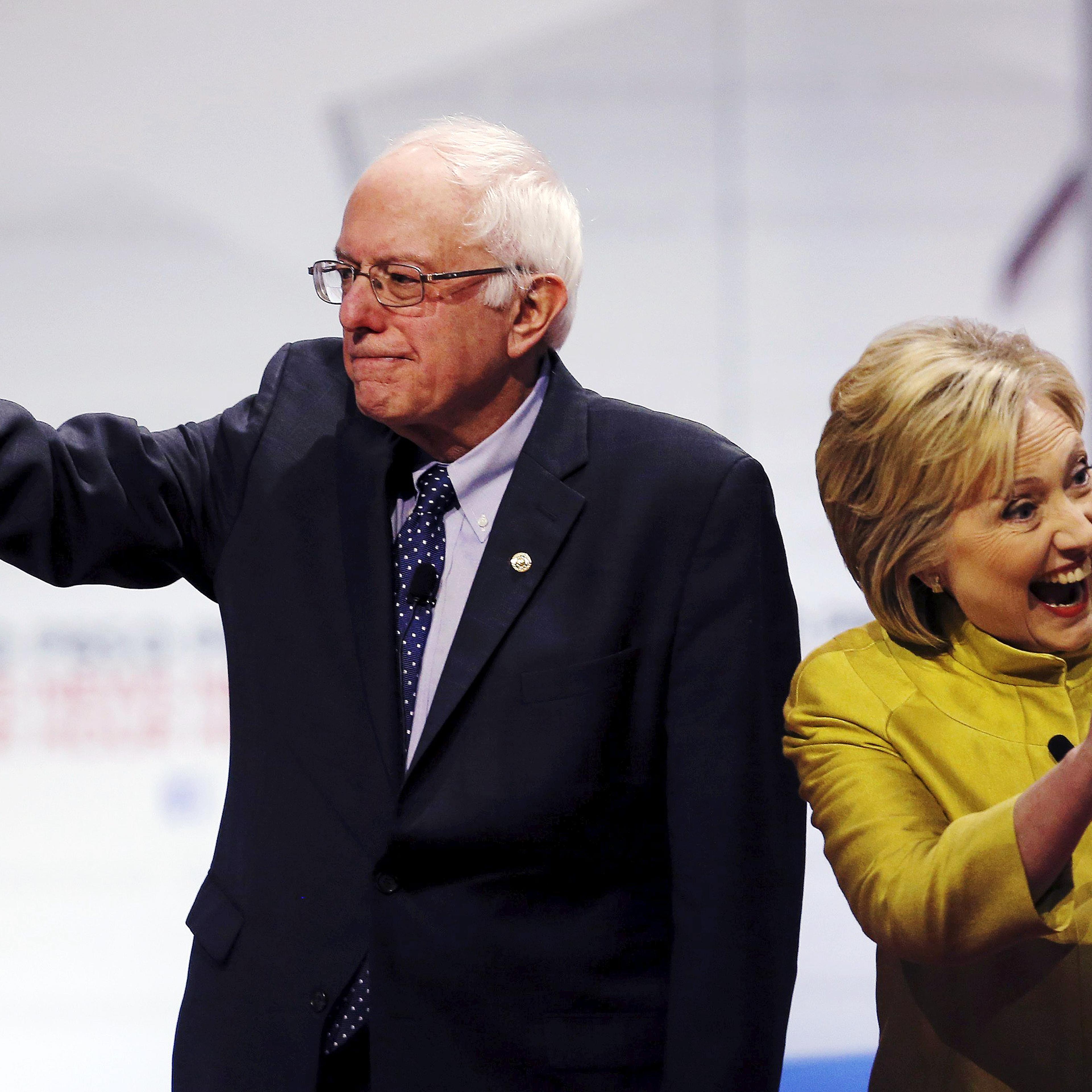Democratic U.S. presidential candidates Senator Bernie Sanders and former Secretary of State Hillary Clinton arrive on stage before the start of the PBS NewsHour Democratic presidential candidates debate in Milwaukee