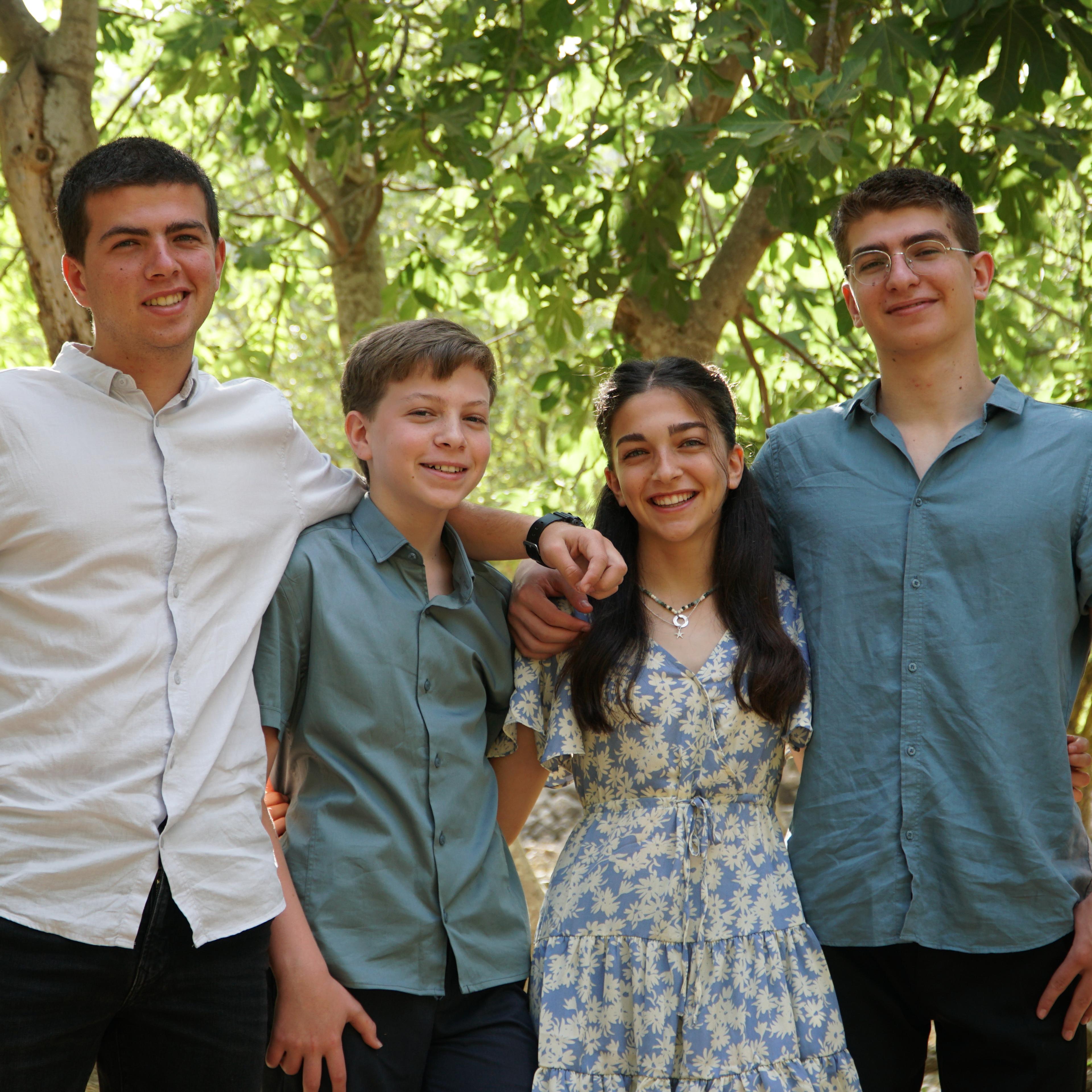 Yannai Kaminka (left) with his four siblings at his brother's Bar Mitzvah.
