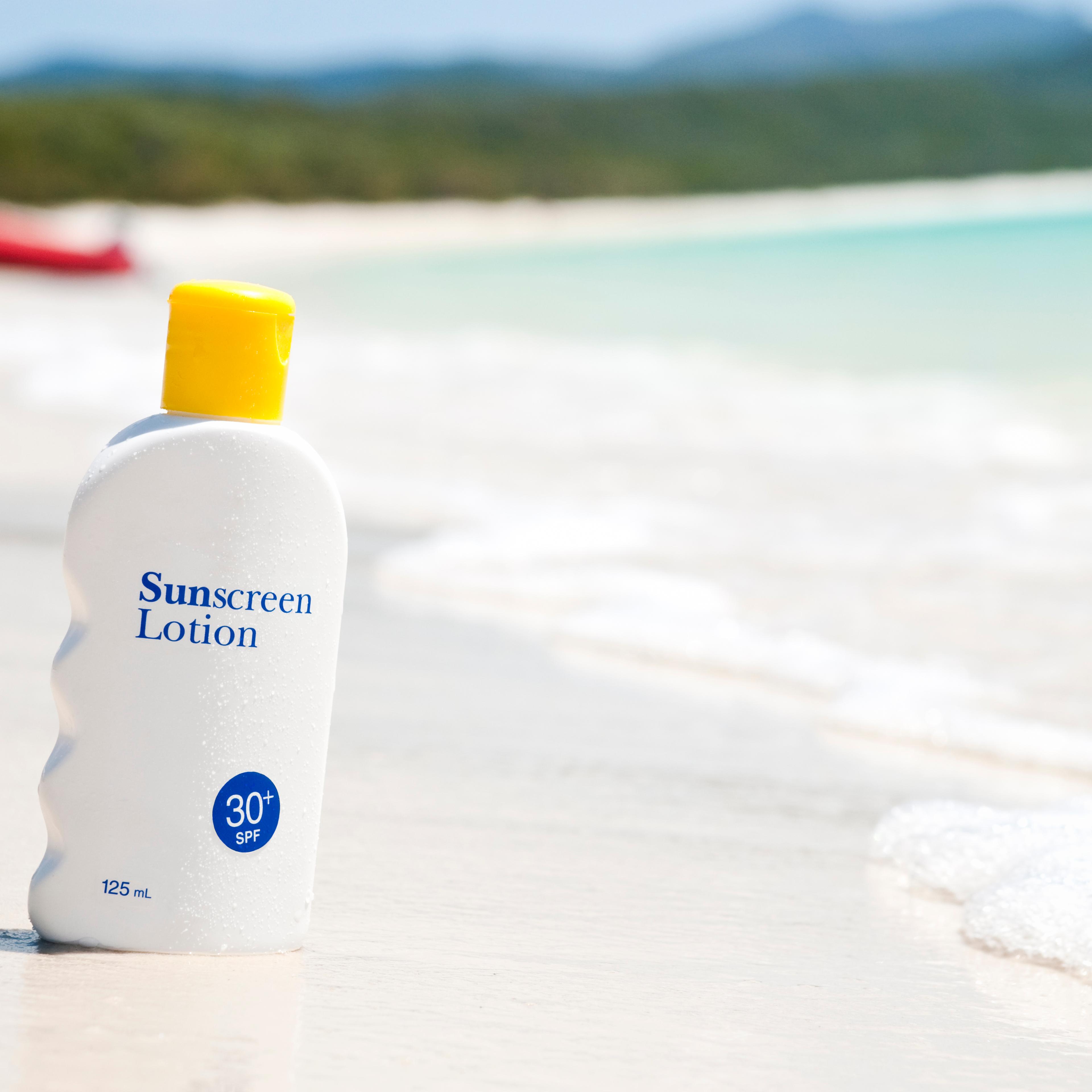 Sunscreen lotion on the beach