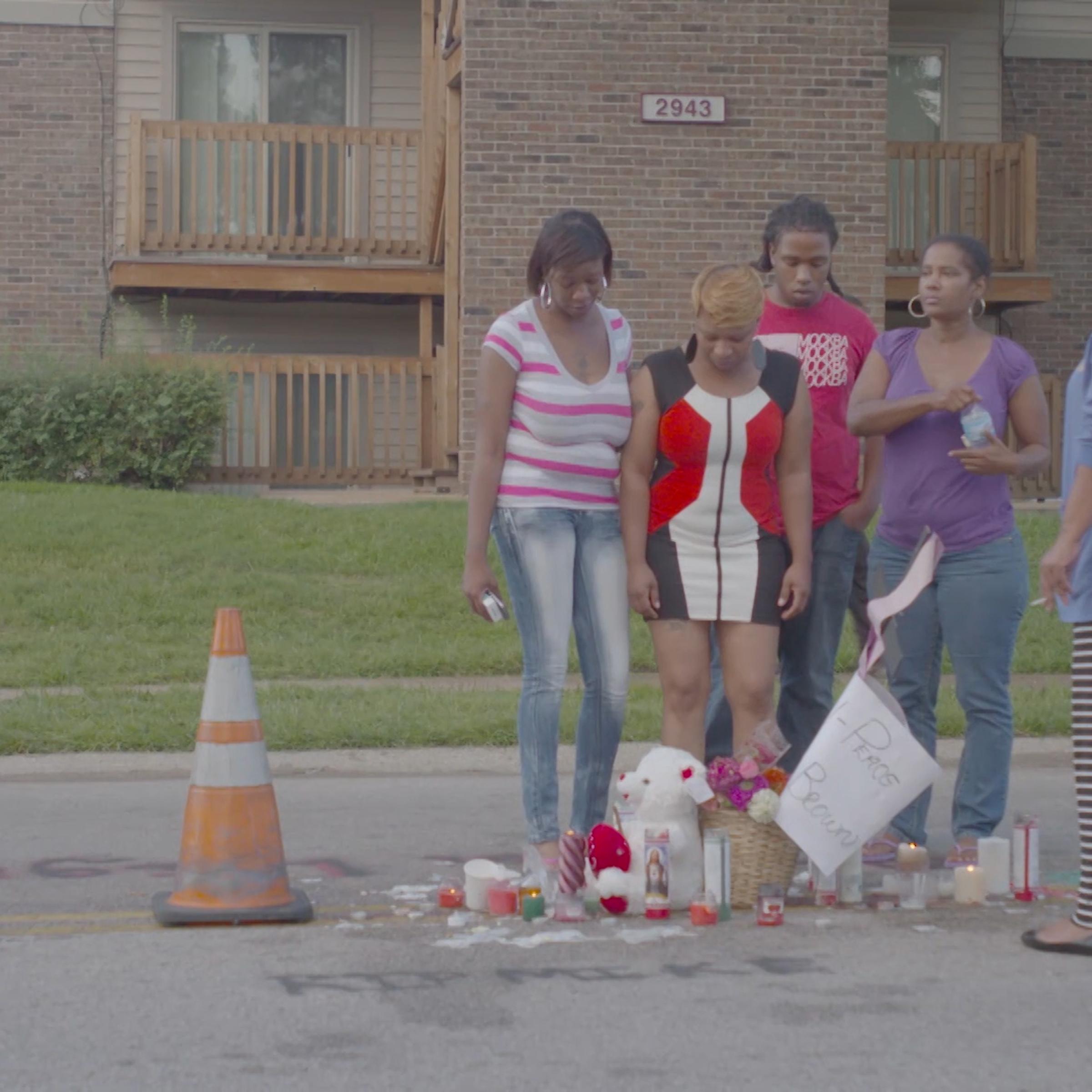 Michael Brown's mother visits the place where he was gunned down.