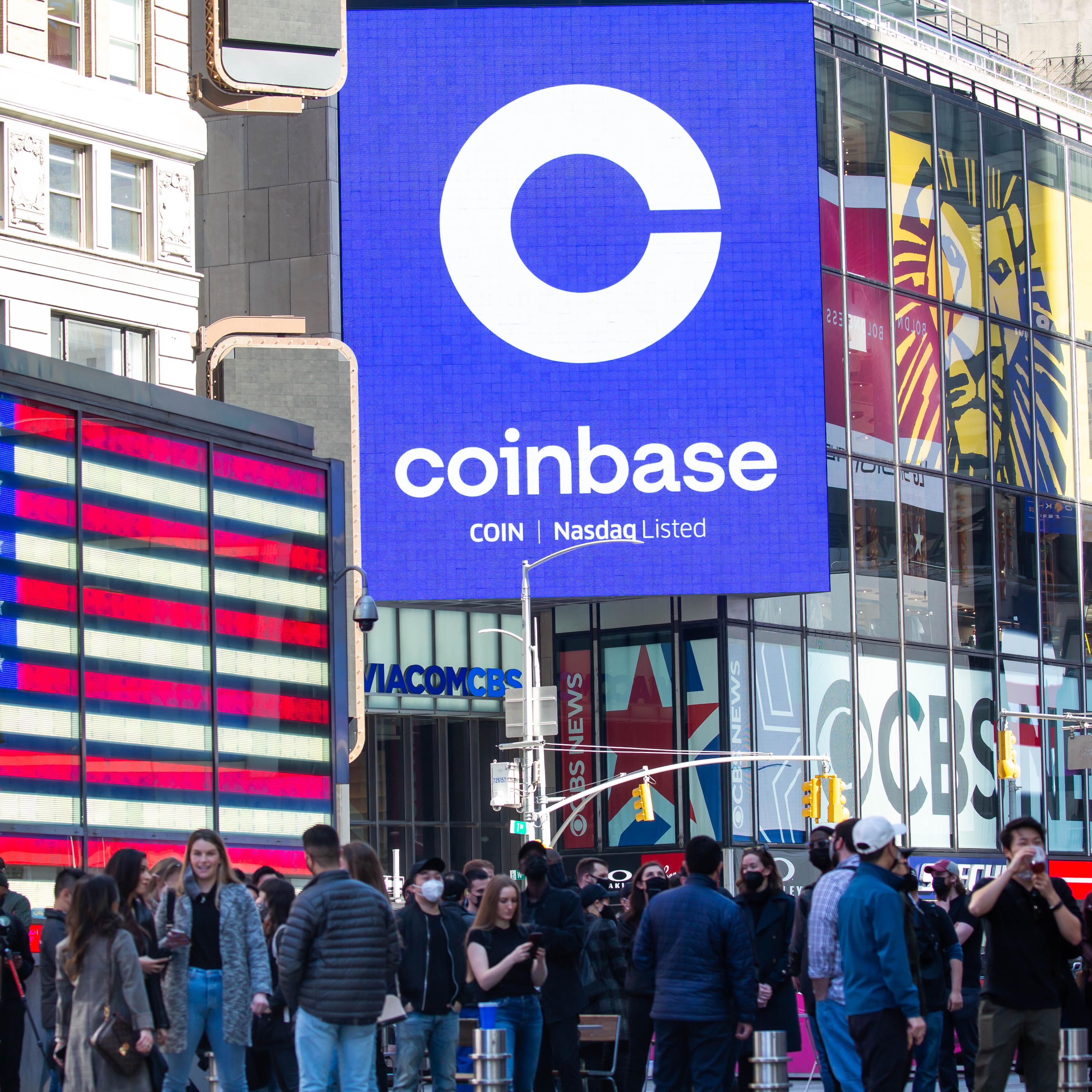 Monitors display Coinbase signage during the company's initial public offering (IPO) at the Nasdaq MarketSite in New York, on April 14, 2021.