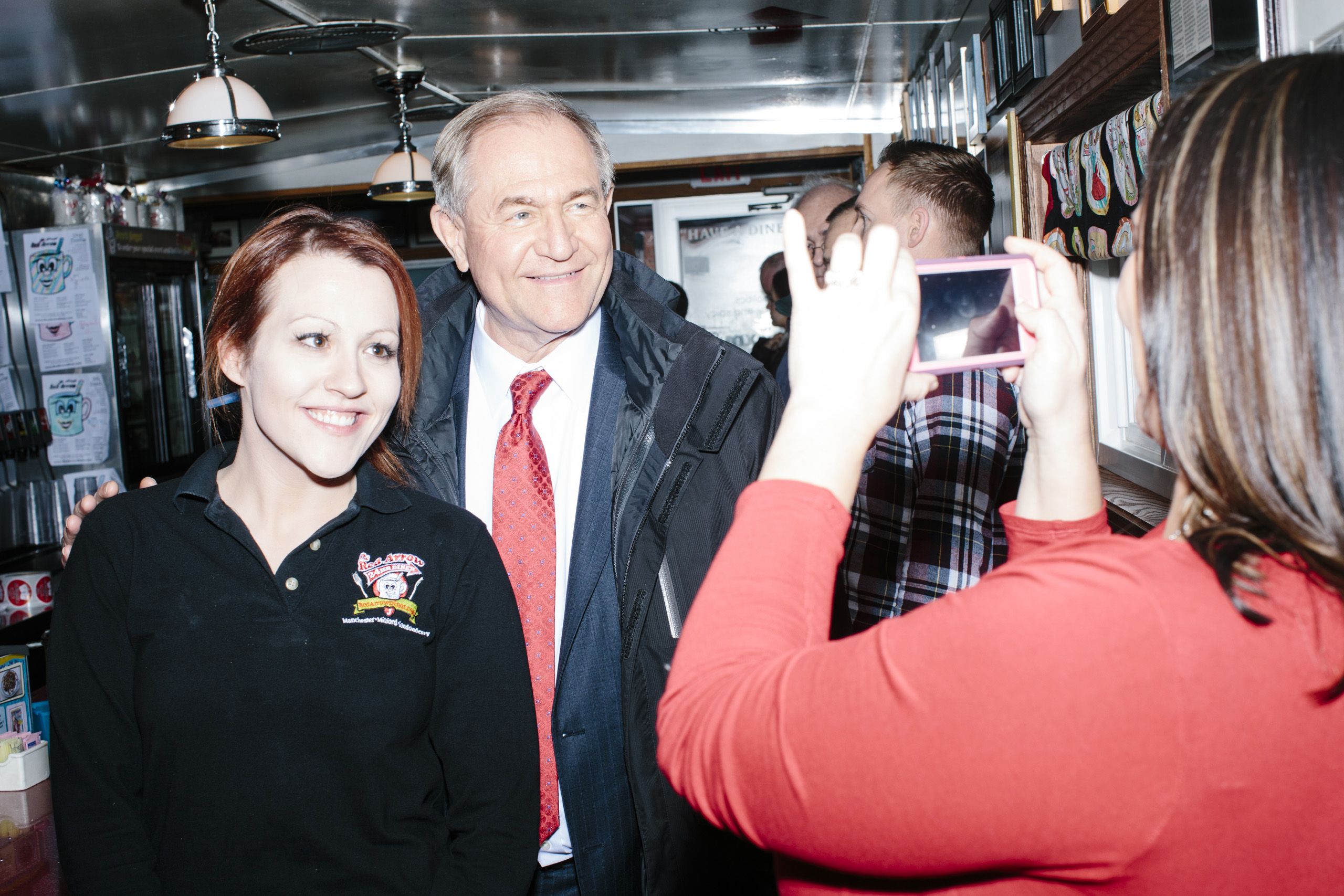 Former Virginia governor and Republican presidential candidate Jim Gilmore poses for a picture with general manager Jayme Lemay, of Nashua, NH, at the Red Arrow Diner in Manchester, New Hampshire, on Mon., Feb. 8, 2016. The Red Arrow Diner is a frequent 