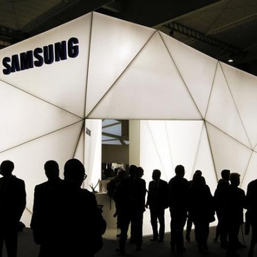 Visitors are seen in front of the Samsung stand during the Mobile World Congress at Barcelona, February 27, 2013.