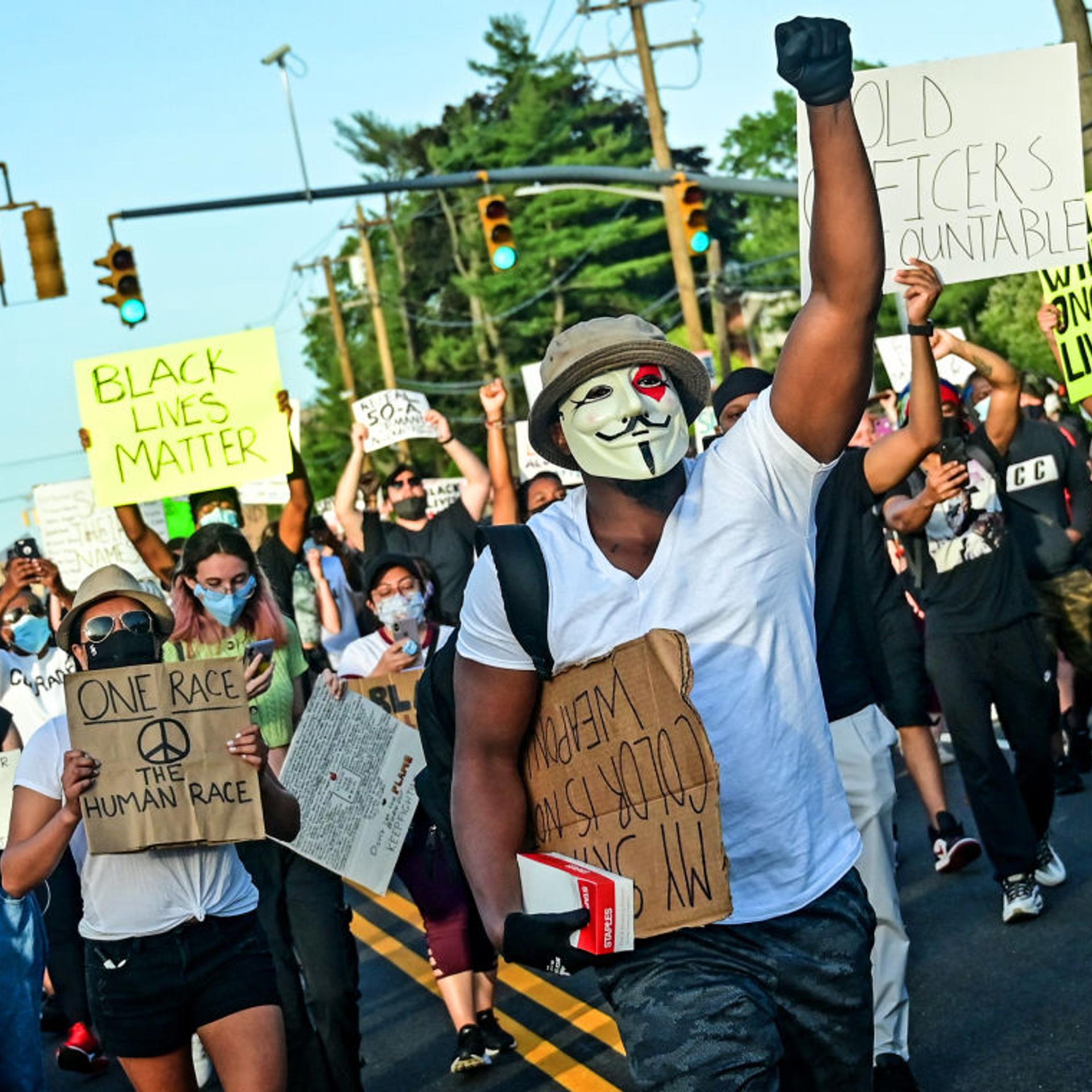 Masked protesters march peacefully against racism on Long Island