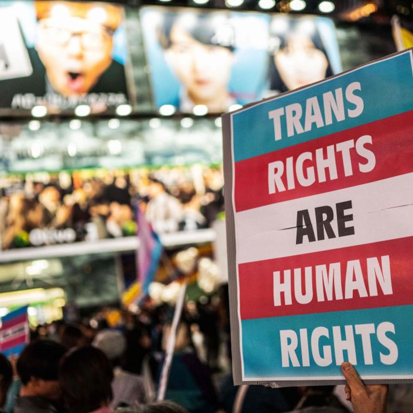 A participant holds up a placard during the International Transgender Day of Visibility rally in Shibuya district of Tokyo on March 31, 2023.