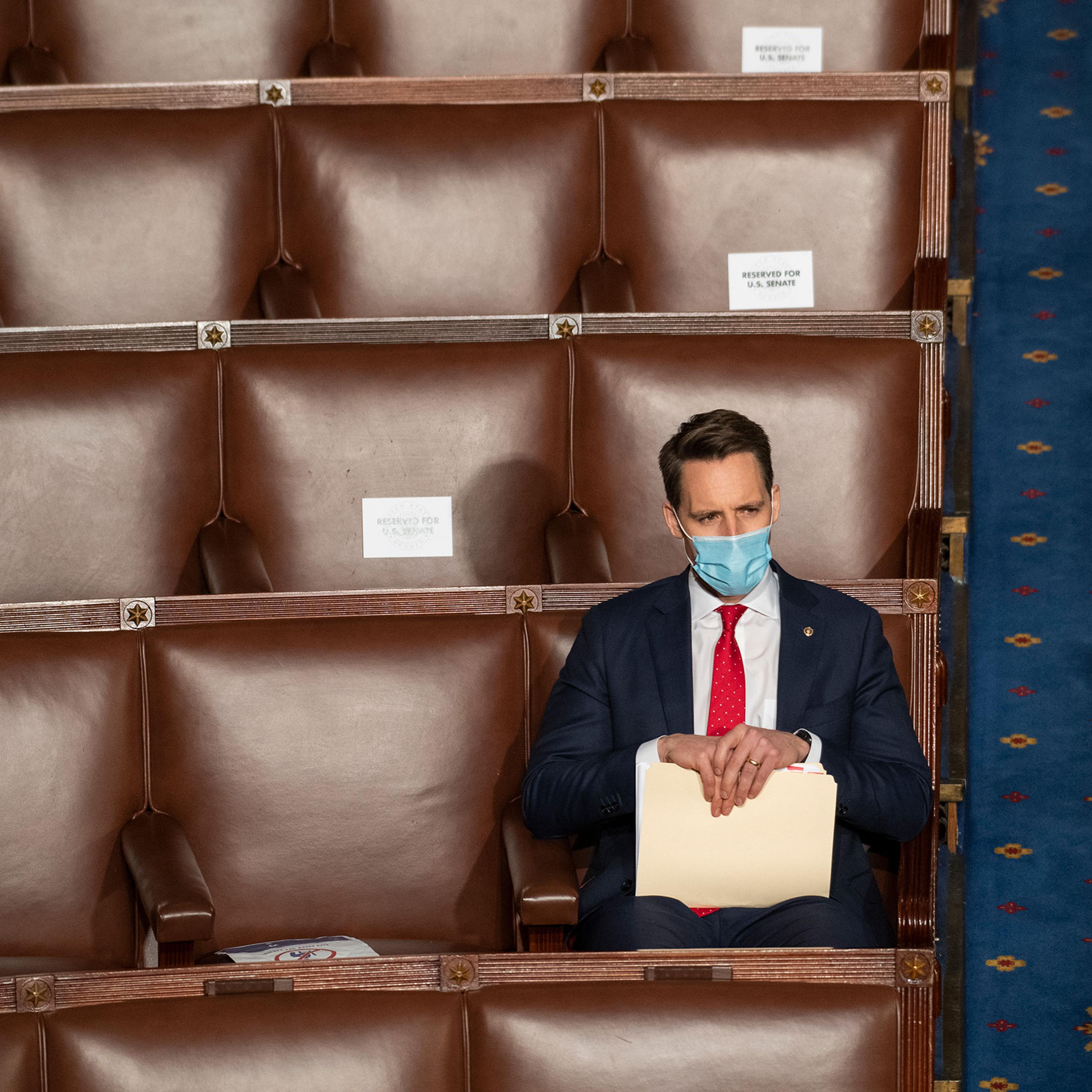 Sen. Josh Hawley attends a joint session of Congress to certify the Electoral College votes of the 2020 presidential election in the House chamber on Jan. 6, 2021.