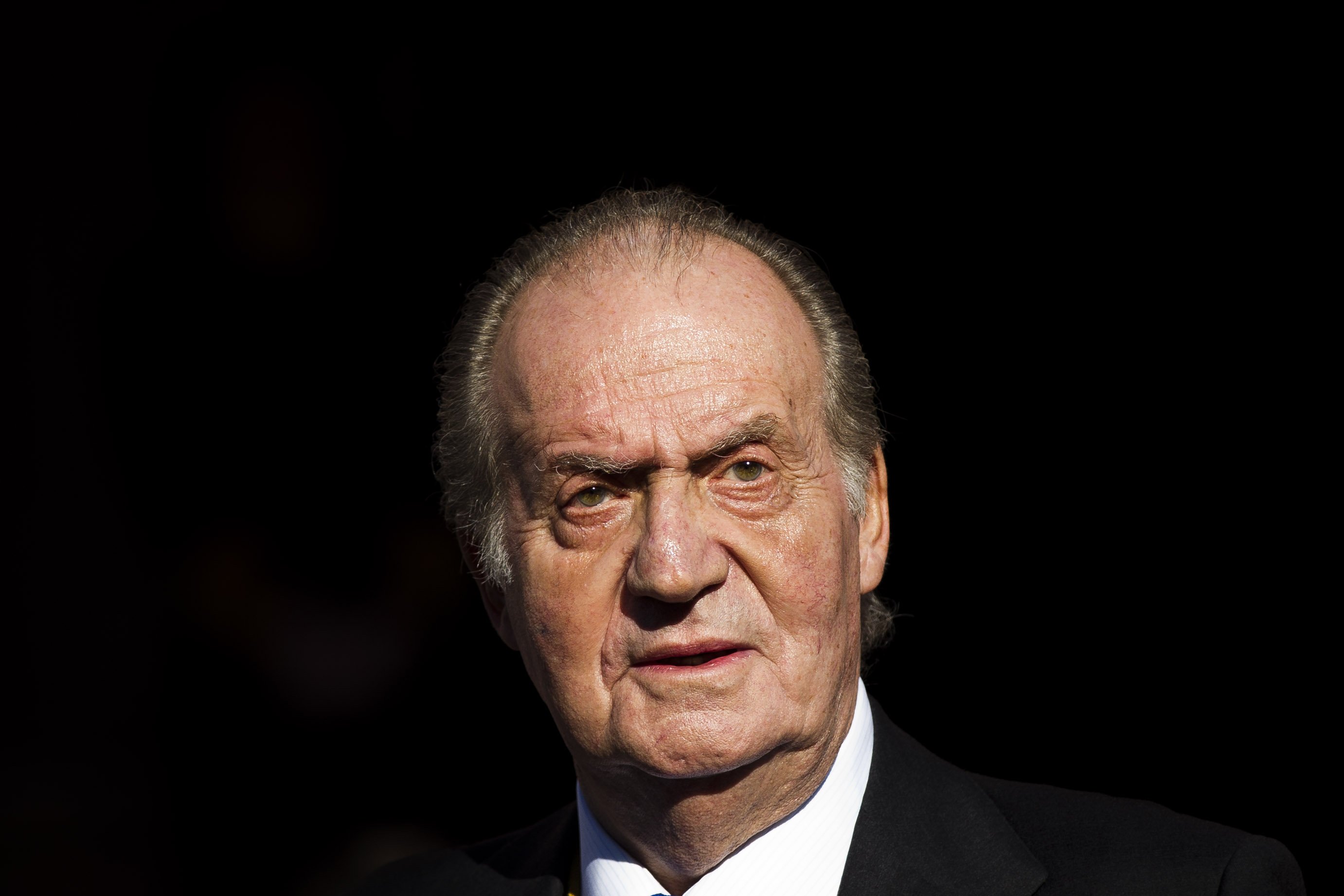 Spain's King Juan Carlos leaves after the official opening of the Parliament, in Madrid on Dec. 27, 2011.