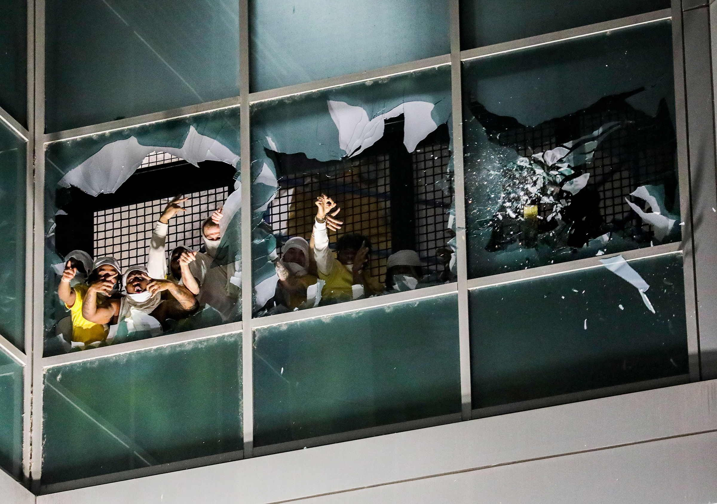 Prisoners in a cell block break windows and chant in protest at the St. Louis City Justice Center, on April 4