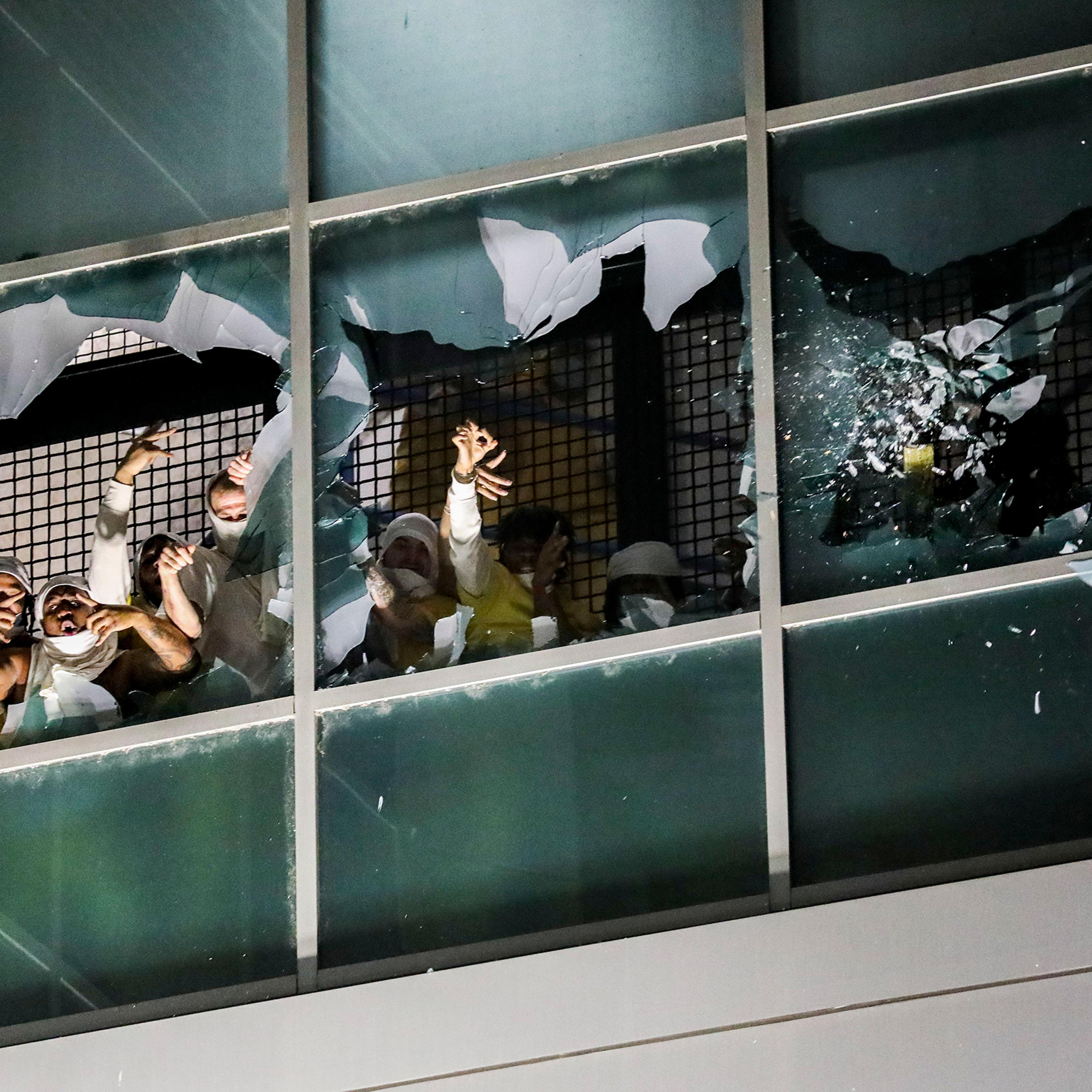 Prisoners in a cell block break windows and chant in protest at the St. Louis City Justice Center, on April 4