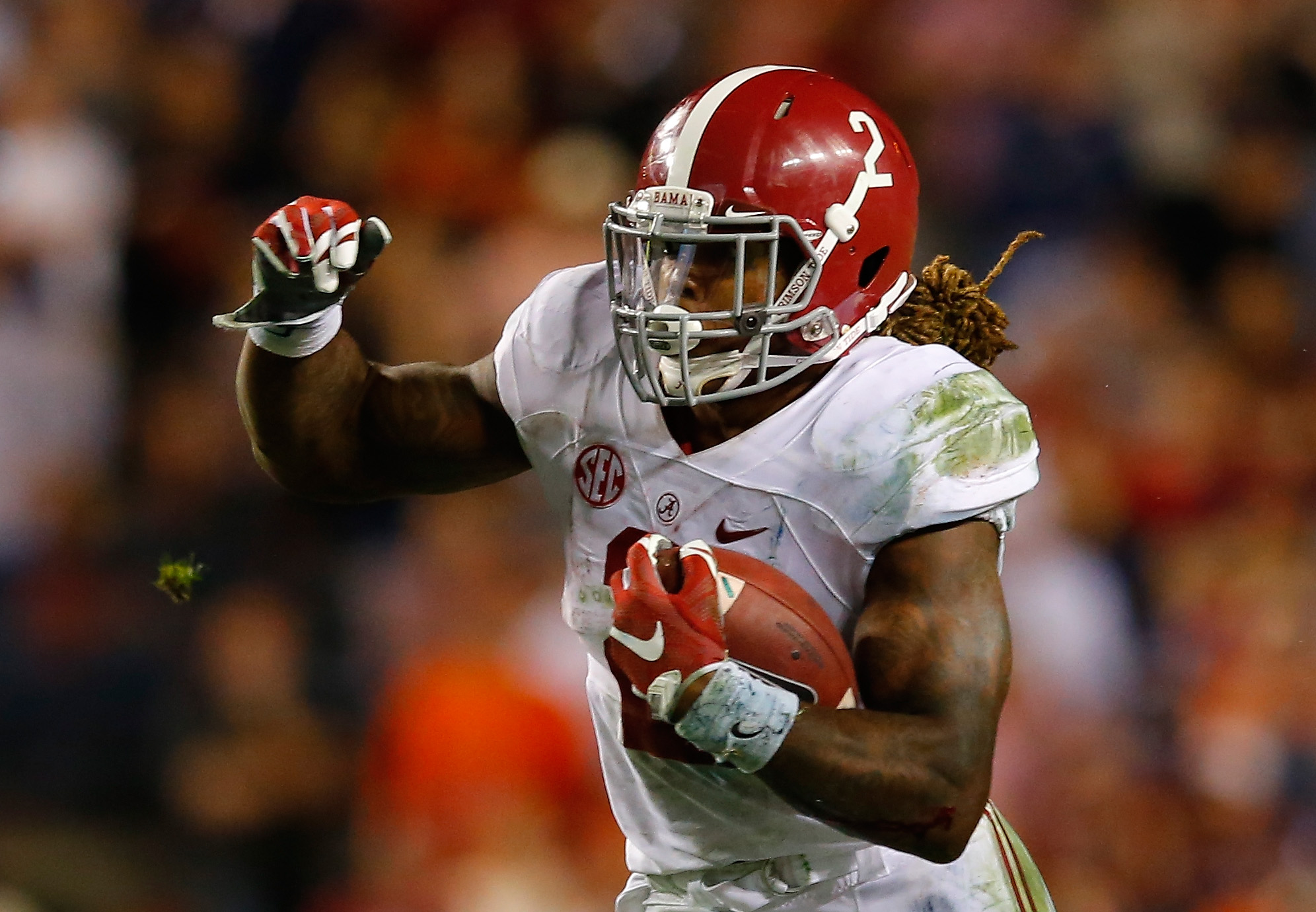 Derrick Henry #2 of the Alabama Crimson Tide rushes against the Auburn Tigers at Jordan Hare Stadium in Auburn, Alabama on Nov. 28, 2015.