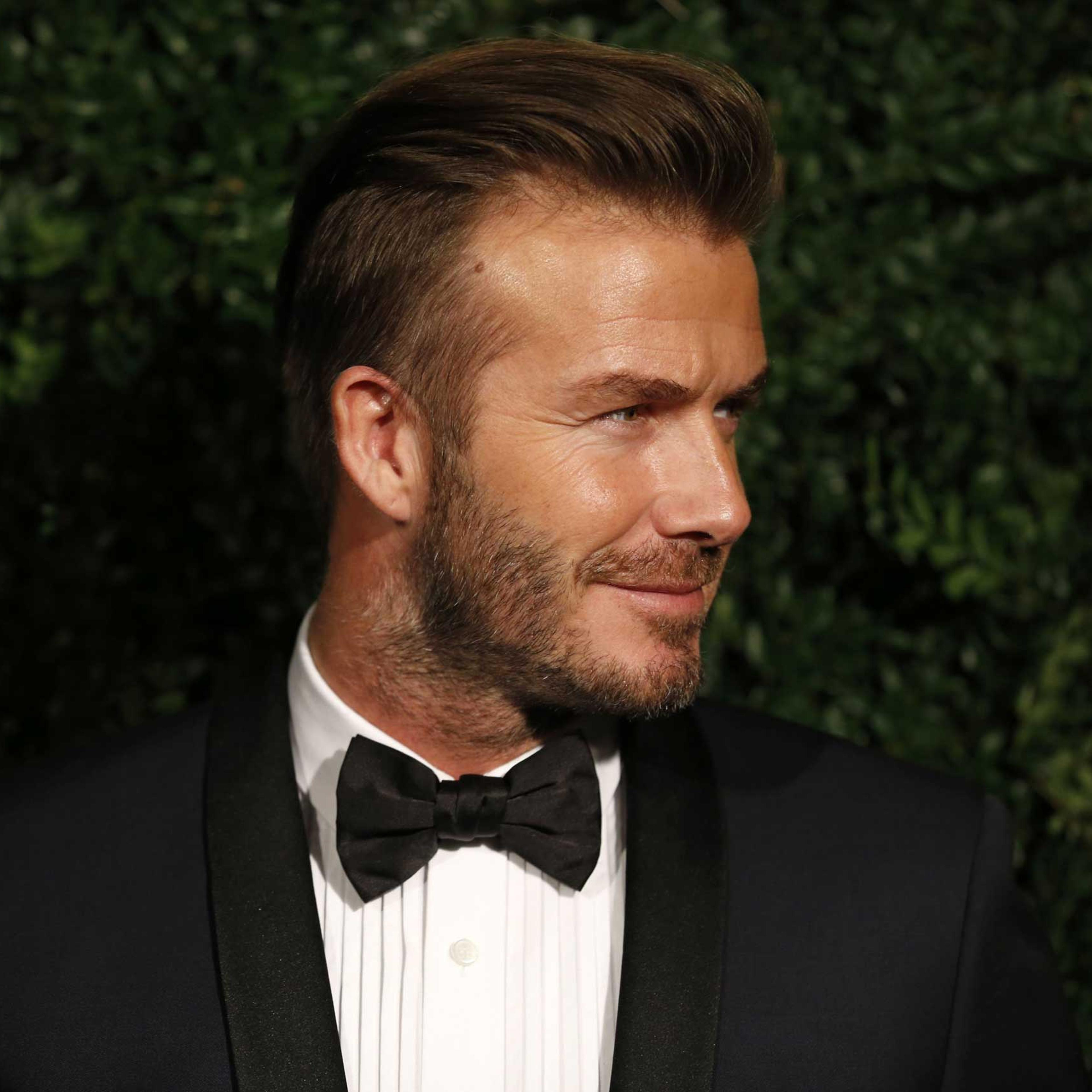 David Beckham poses on the red carpet as he attends the 60th London Evening Standard Theatre Awards 2014 in London on Nov. 30, 2014.