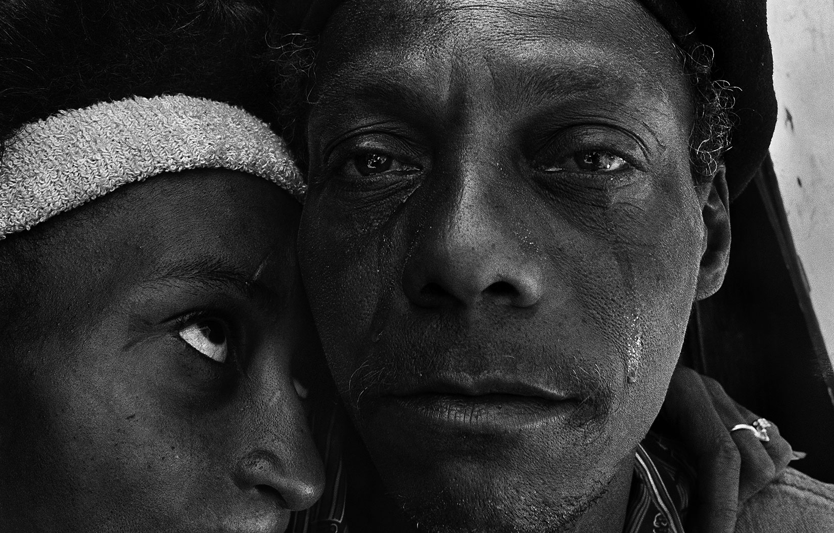  Below The Line: Living Poor in America, Bronx Documentary Center, N.Y.: Oct. 1 - Nov. 6   (Caption: Back from prison, Shantytown, New York, 1986)