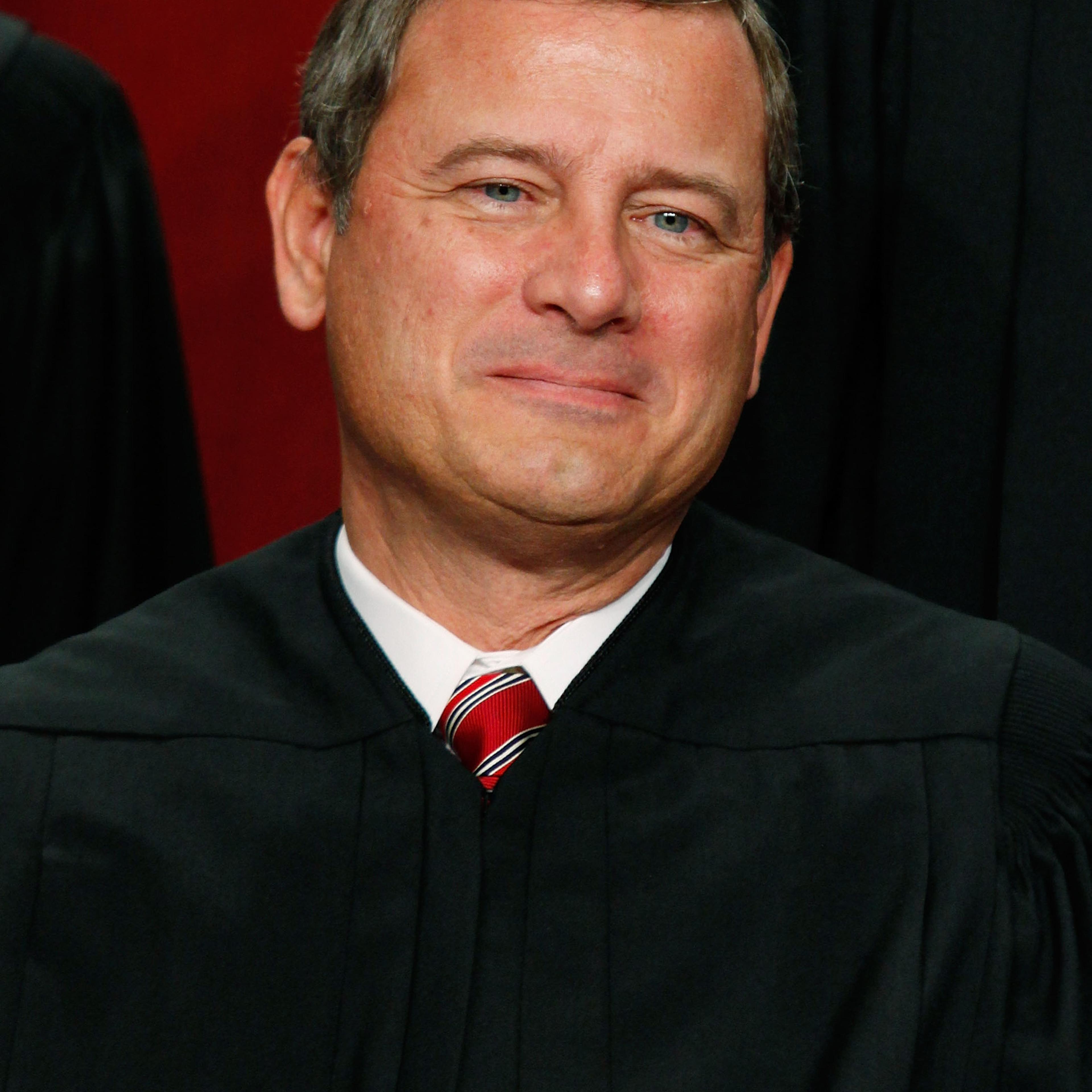 Chief Justice John G. Roberts poses for a group photograph at the Supreme Court building on Sept. 29, 2009 in Washington DC.