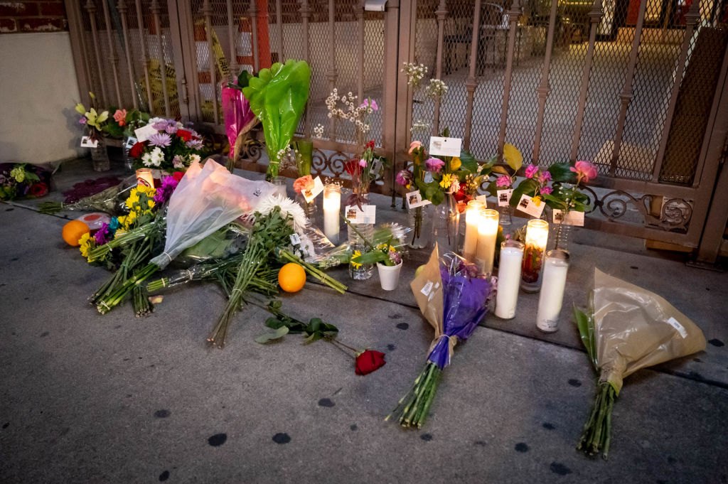 A memorial grows outside the Montery Park Dance Studio Shooting Site