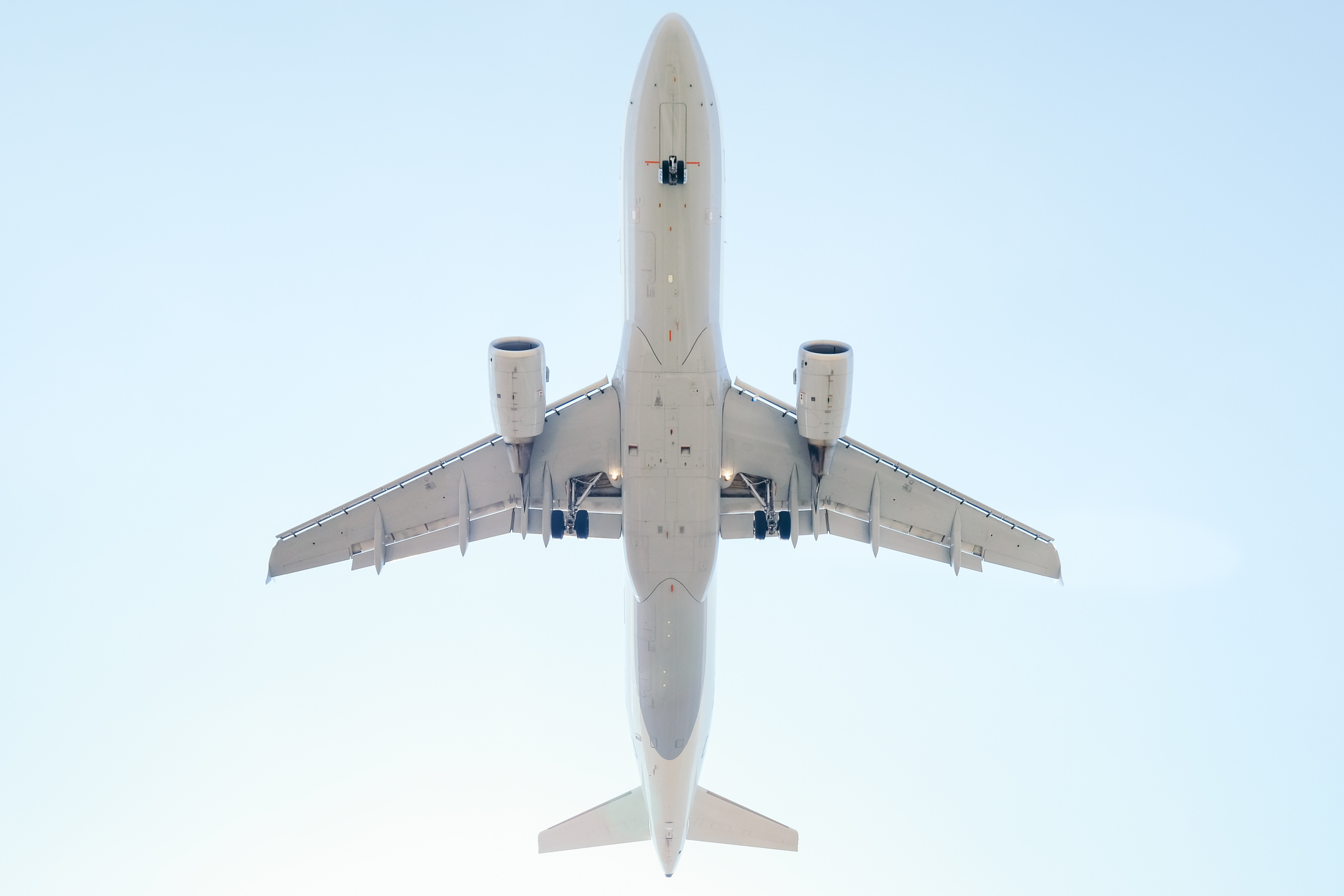 Low Angle View Of Airplane Flying Against Sky