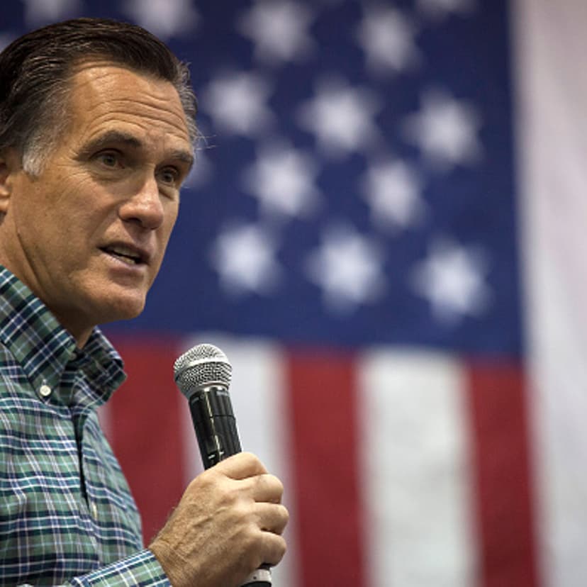 Former Massachusetts Gov. Mitt Romney addresses the crowd during a rally for Republican Senate candidate Dan Sullivan at a PenAir airplane hangar on November 3, 2014 in Anchorage, Alaska.