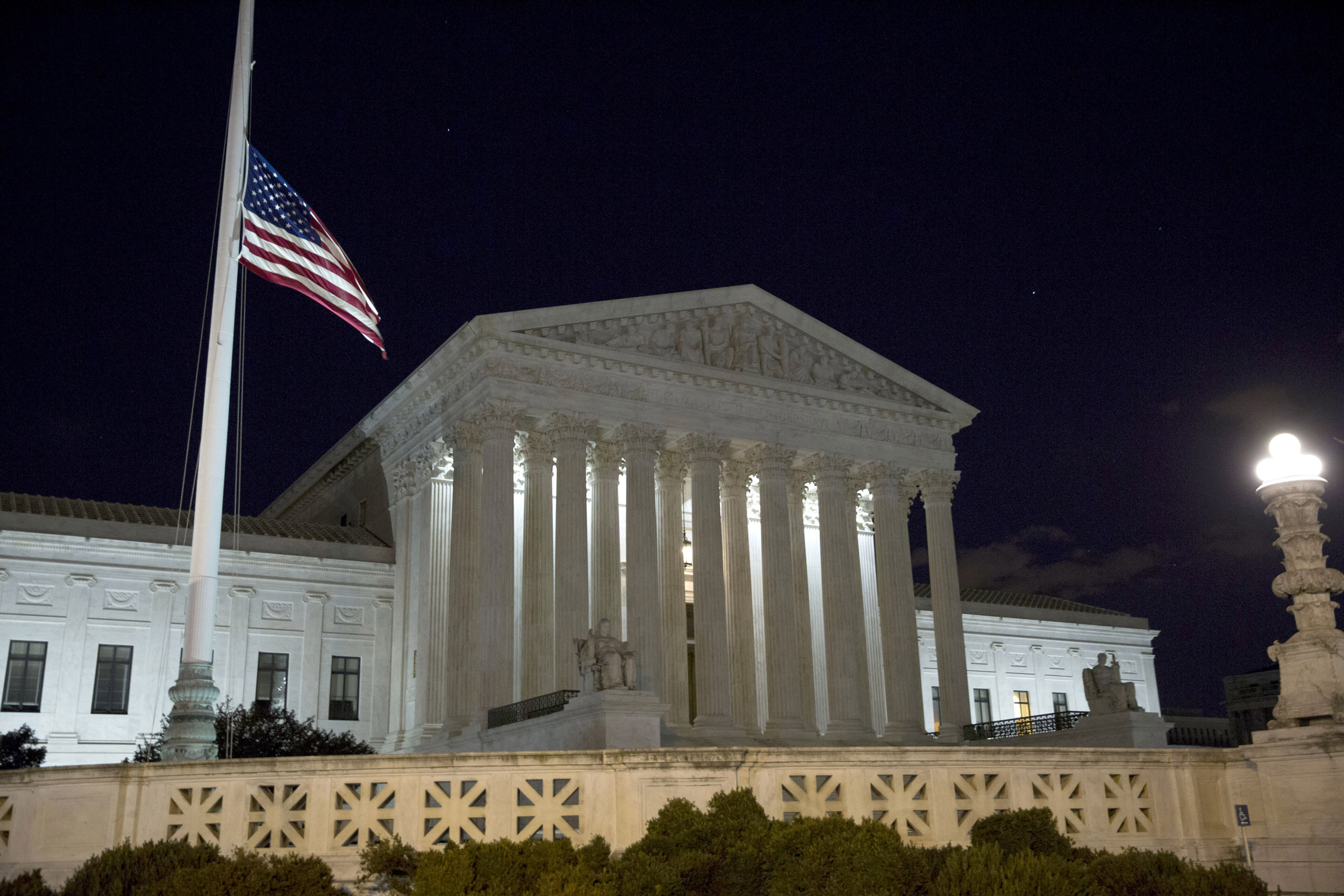 WASHINGTON, DC - FEBRUARY 13: The American flag flies at half mast at the U.S. Supreme Court February 13, 2016 in Washington, DC. Supreme Court Justice Antonin Scalia was at a Texas Ranch Saturday morning when he died at the age of 79. (Photo by Drew Ang