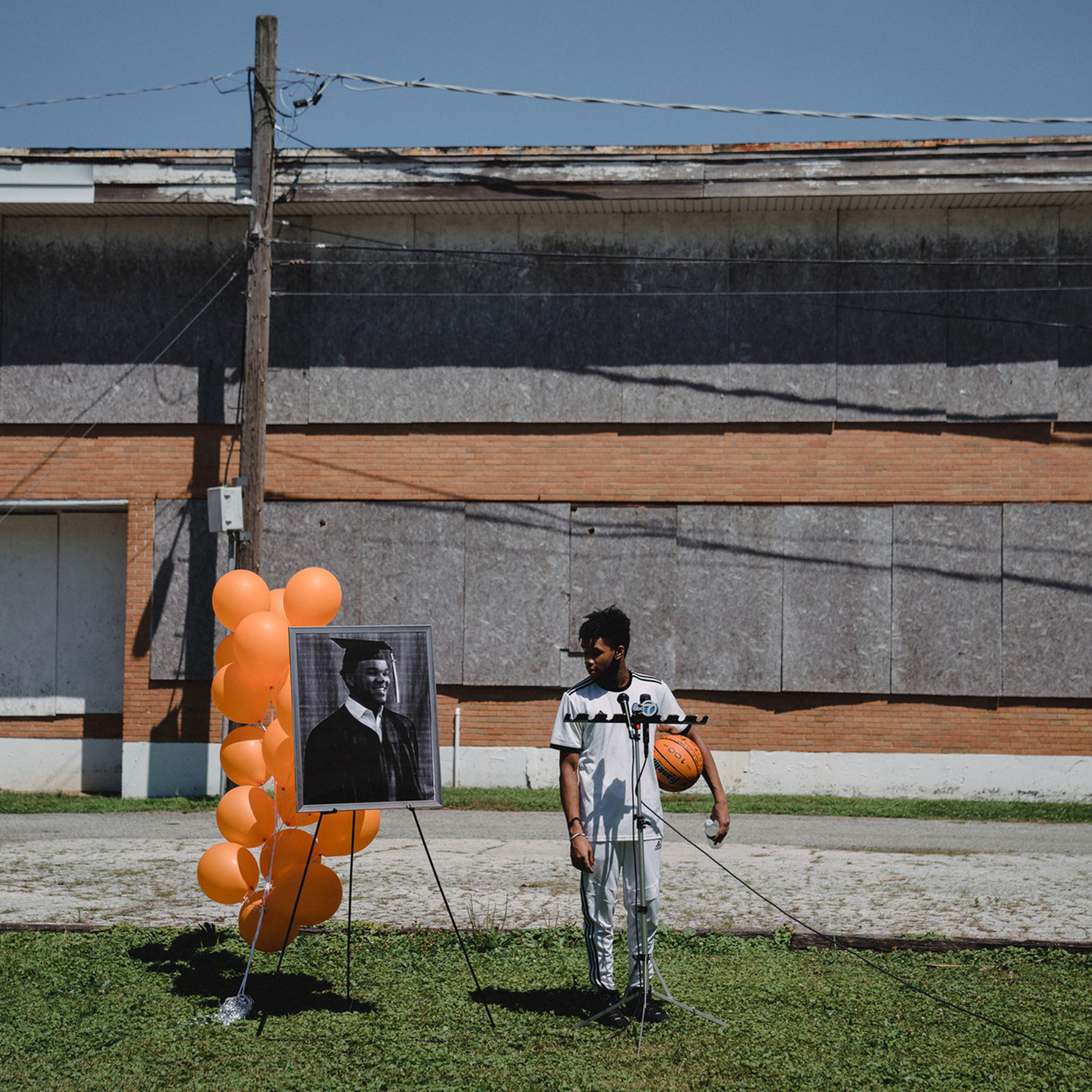 Omarion Swint attends a vigil for his friend since the 3rd grade, 15-year old Terrance Malden, who was shot to death on July 10 in the Jeffrey Manor neighborhood, on July 17, 2020.