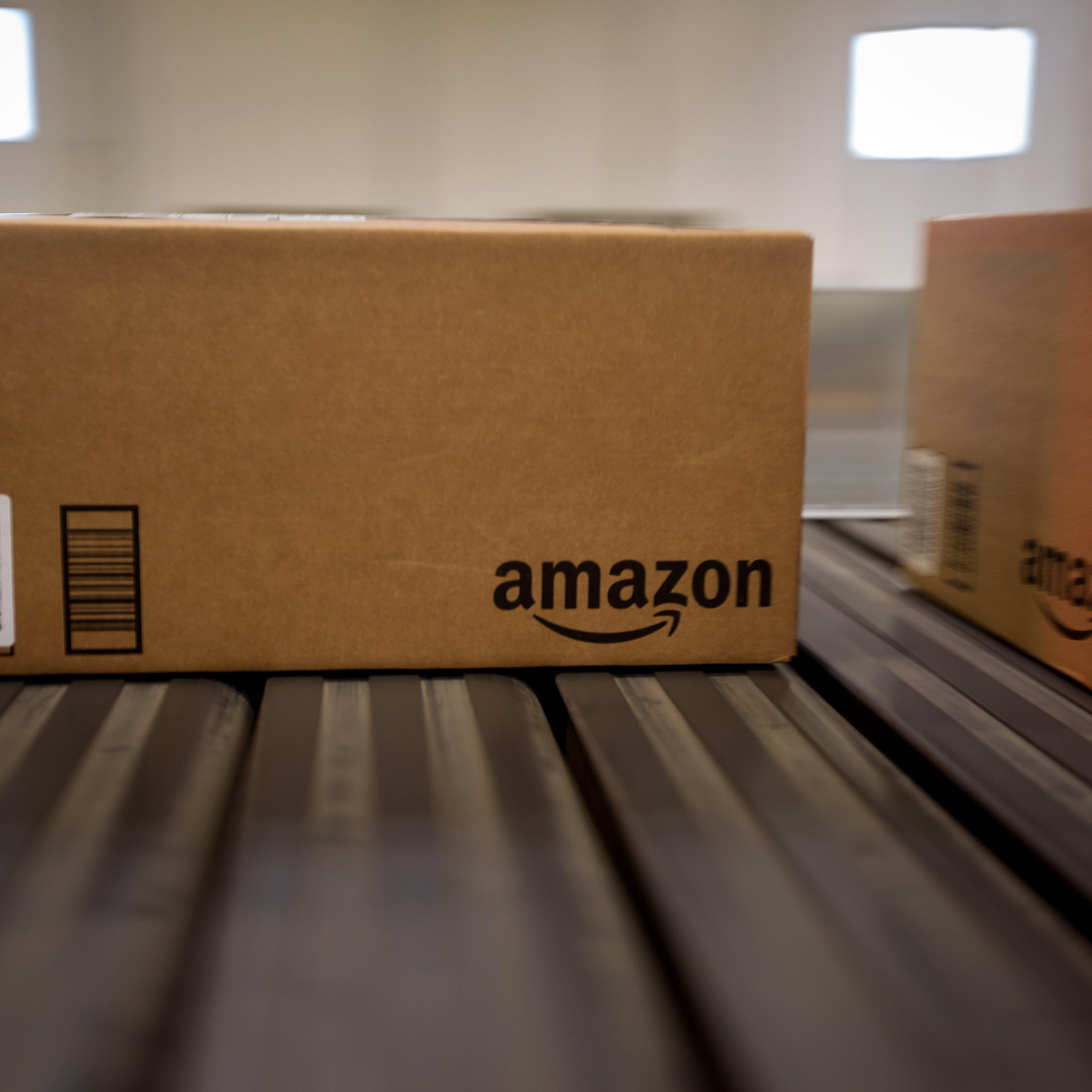 Boxes move along a conveyor belt at the Amazon.com Inc. fulfillment center on Cyber Monday in Robbinsville, New Jersey, U.S., on Monday, Nov. 30, 2015.