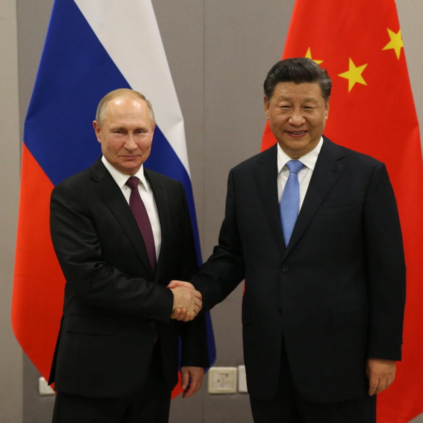 Russian President Vladimir Putin meets Chinese President Xi Jinping at BRICS Summit in Brasilia