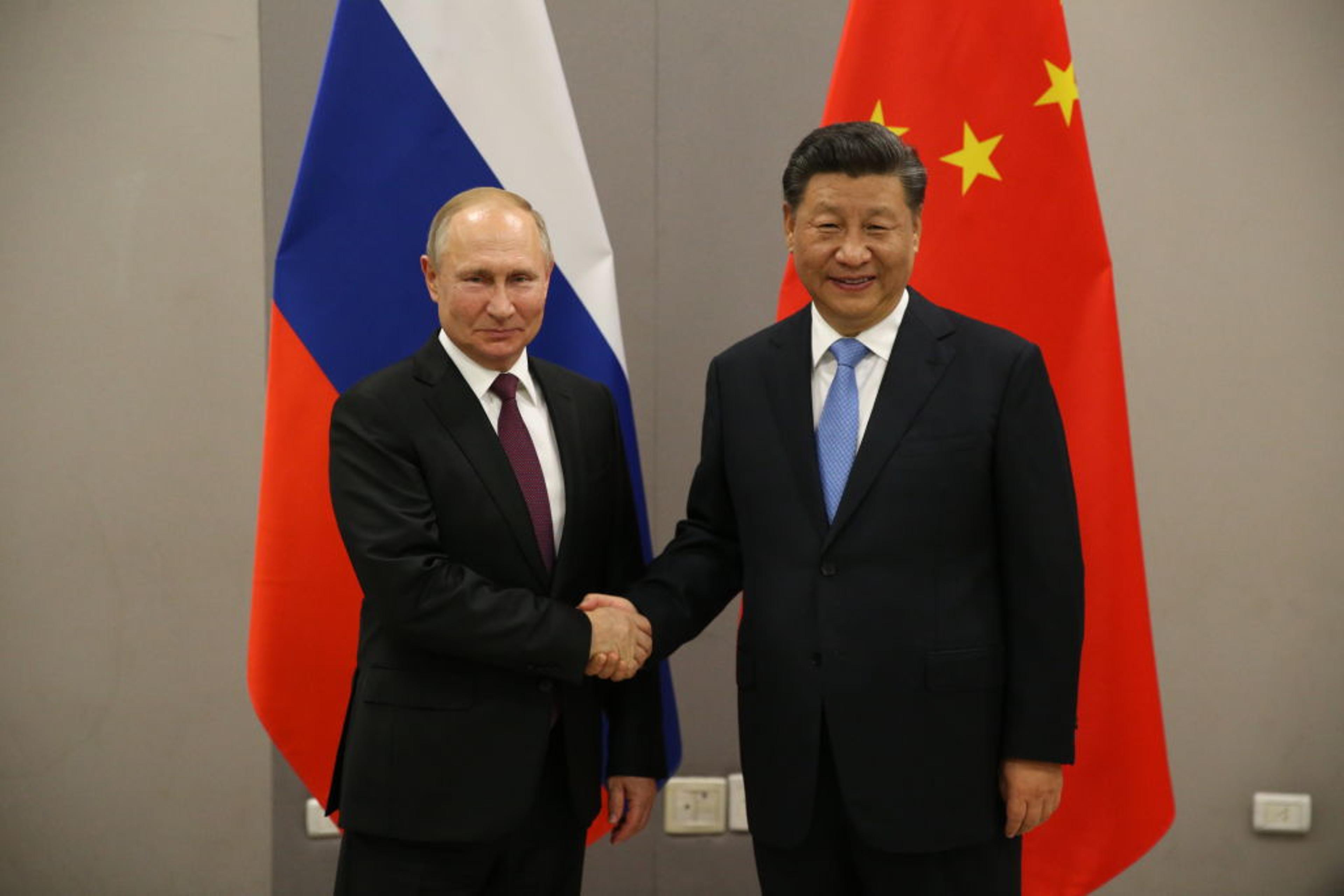 Russian President Vladimir Putin meets Chinese President Xi Jinping at BRICS Summit in Brasilia